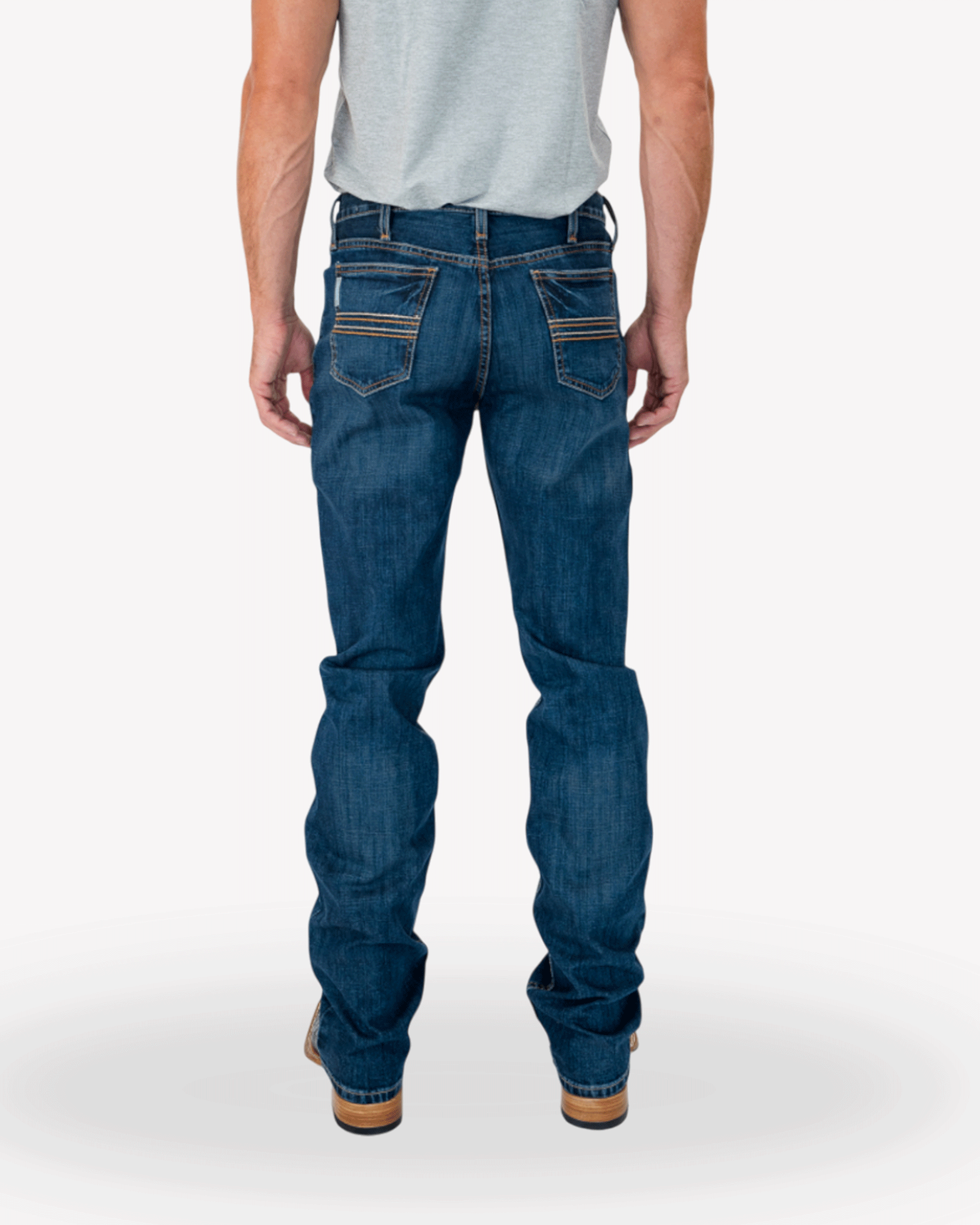 Back view of a man wearing blue denim jeans with a tucked-in t-shirt