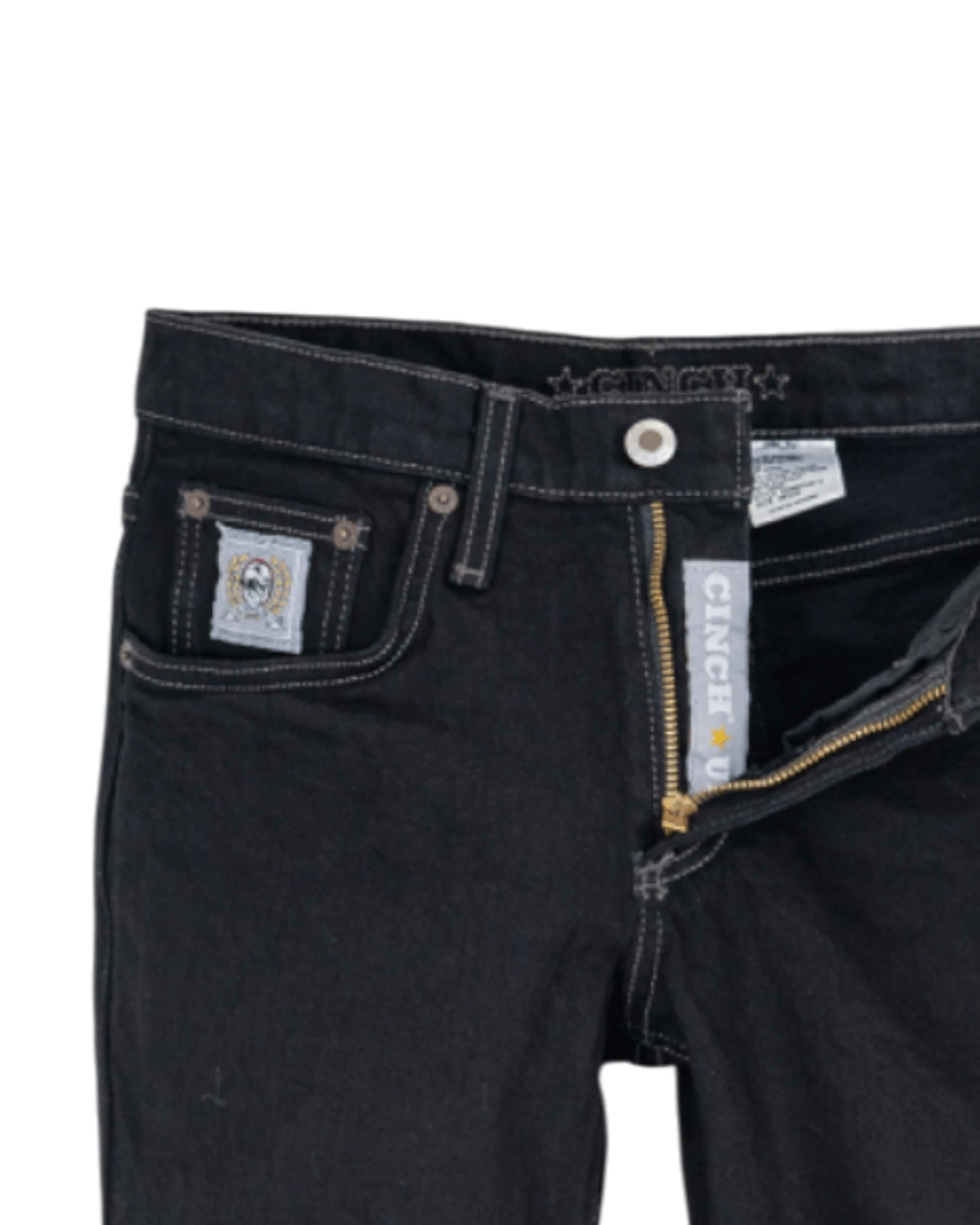 Close-up of black jeans with a brand label on a white background