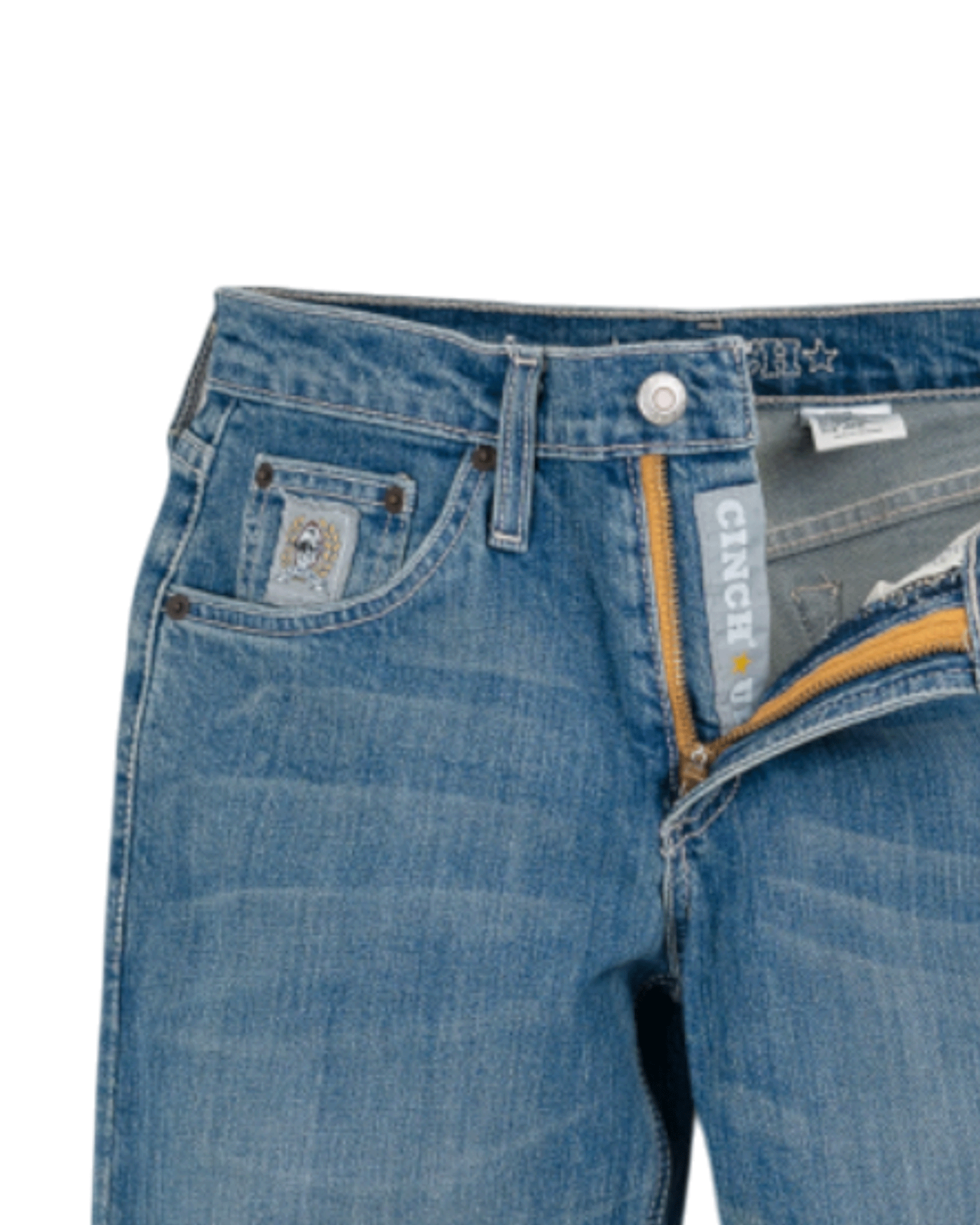 Close-up of blue jeans with brand logo on a white background
