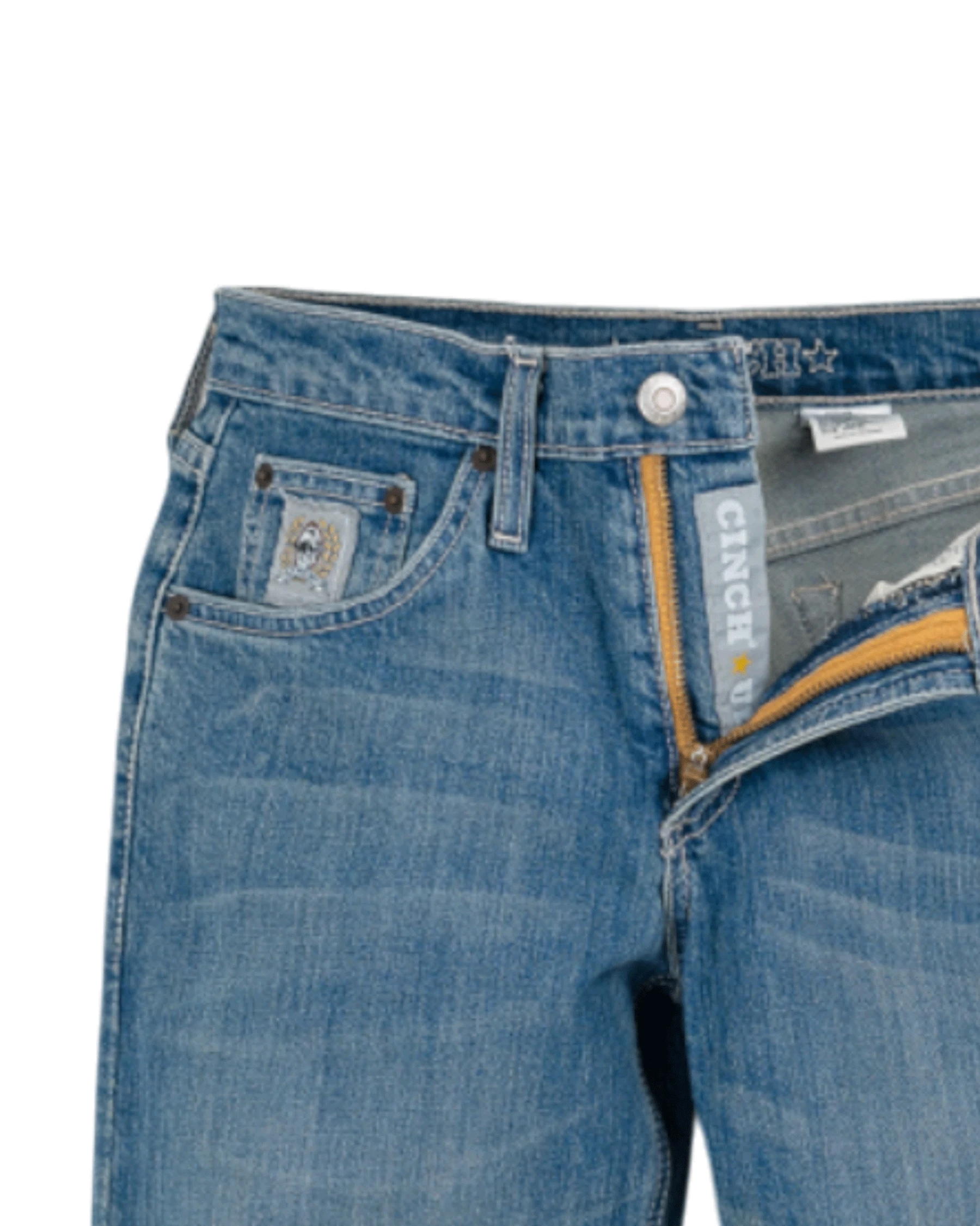 Close-up of blue jeans with brand logo on a white background