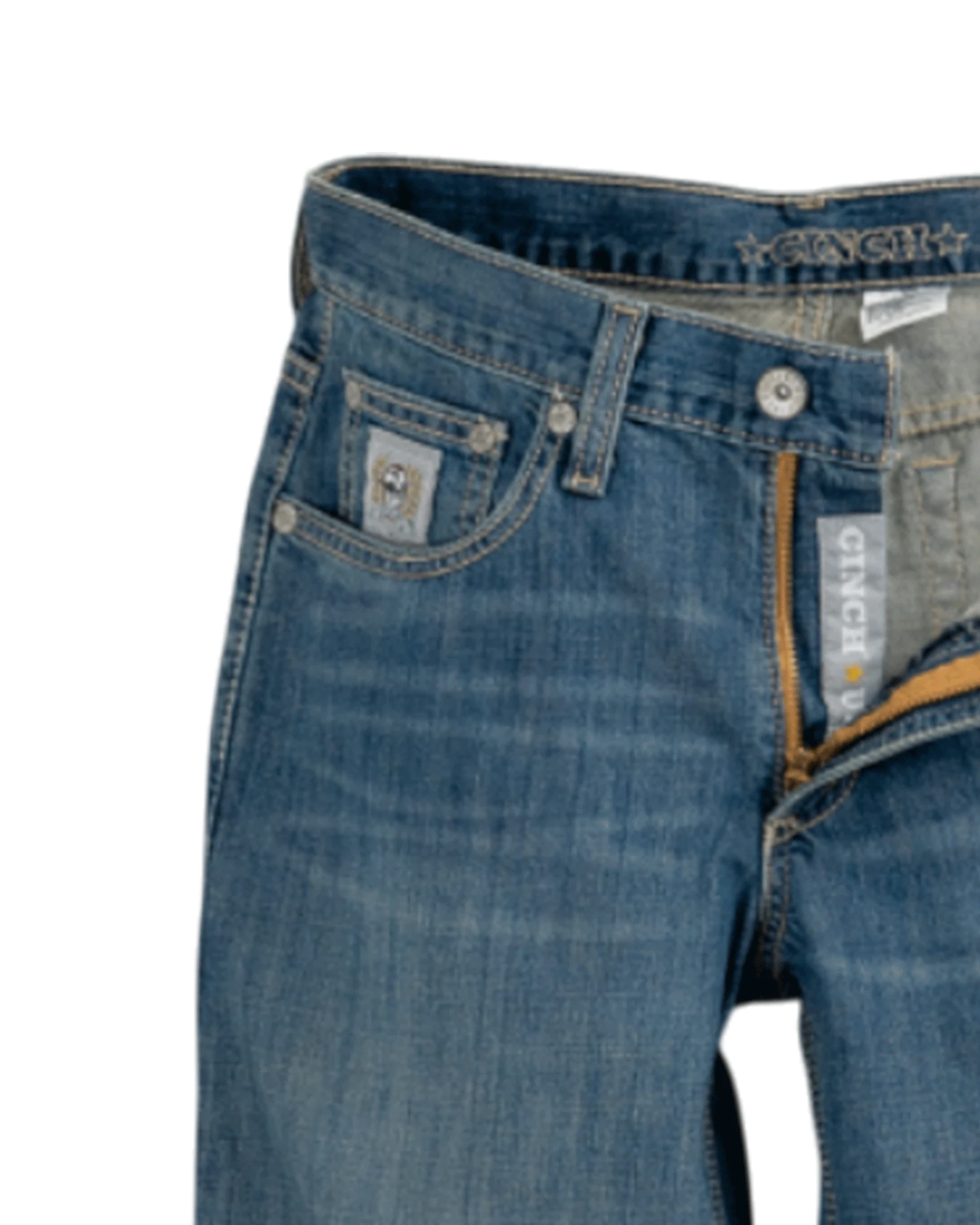 Close-up of blue jeans with visible branding on a white background