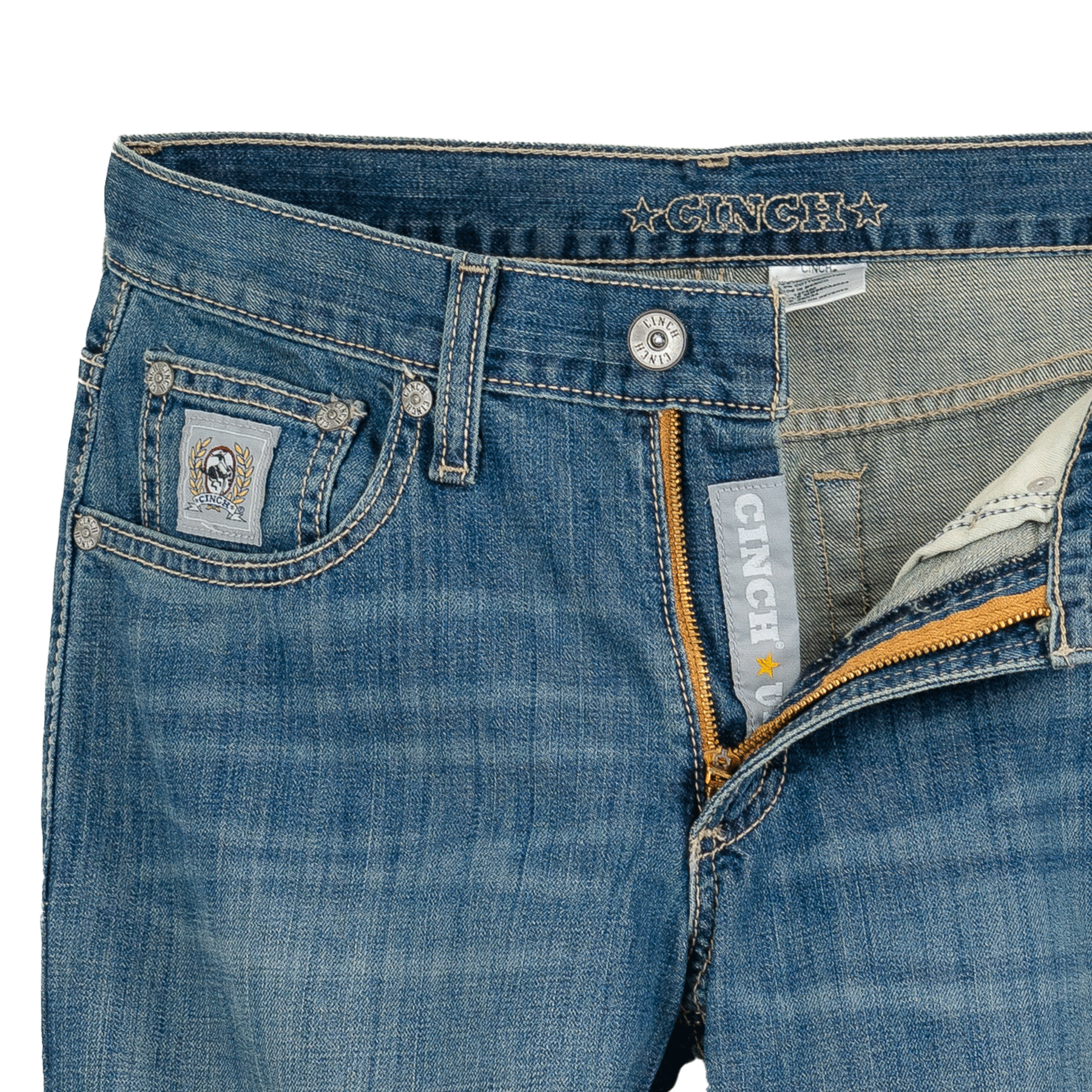 Close-up of blue jeans with visible branding on a white background