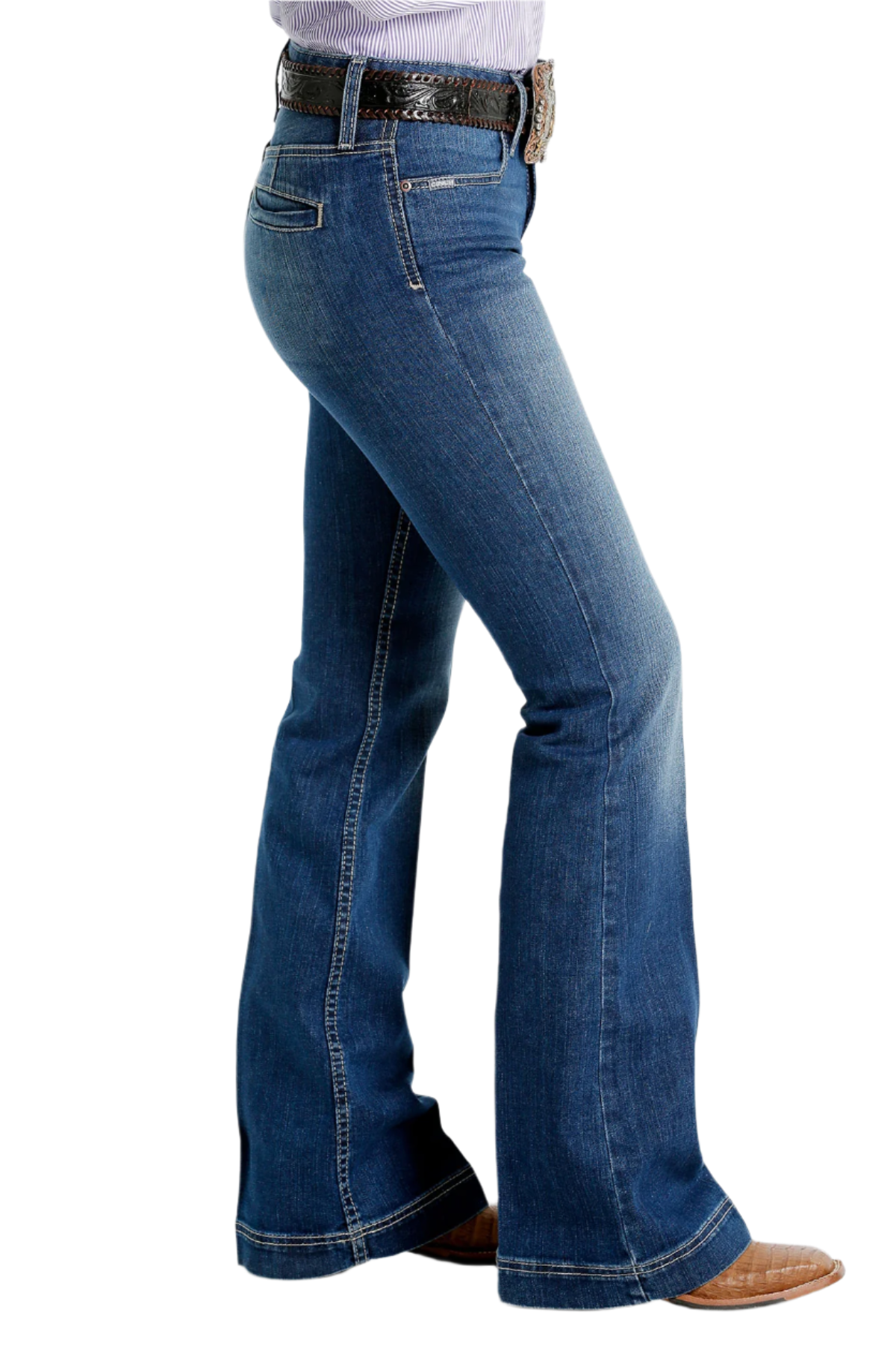 A pair of Cinch ladies slim trouser jeans with welt pockets in a medium stonewash color, including a belt and shoes.