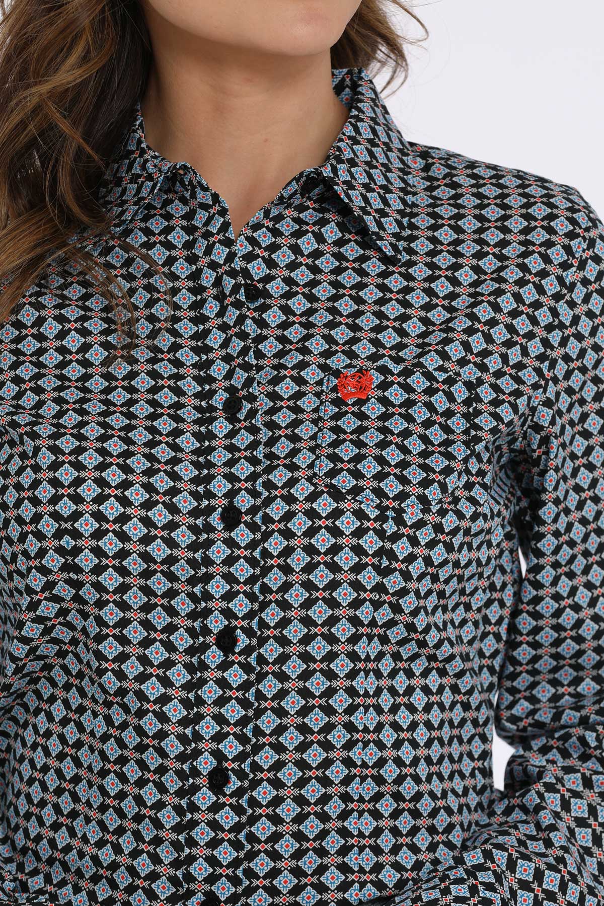 Patterned shirt worn by a person with a neutral background