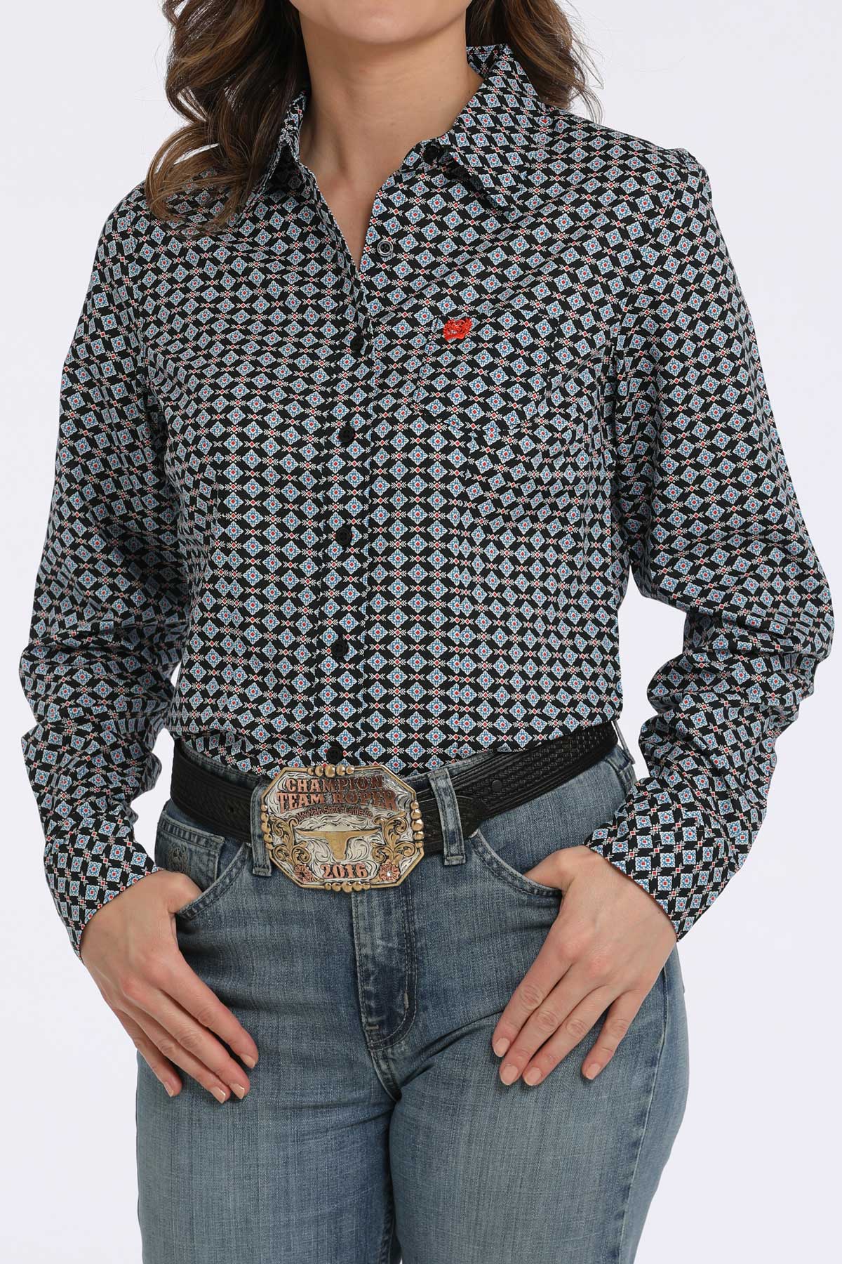 Person wearing a patterned shirt and jeans with a belt on a white background