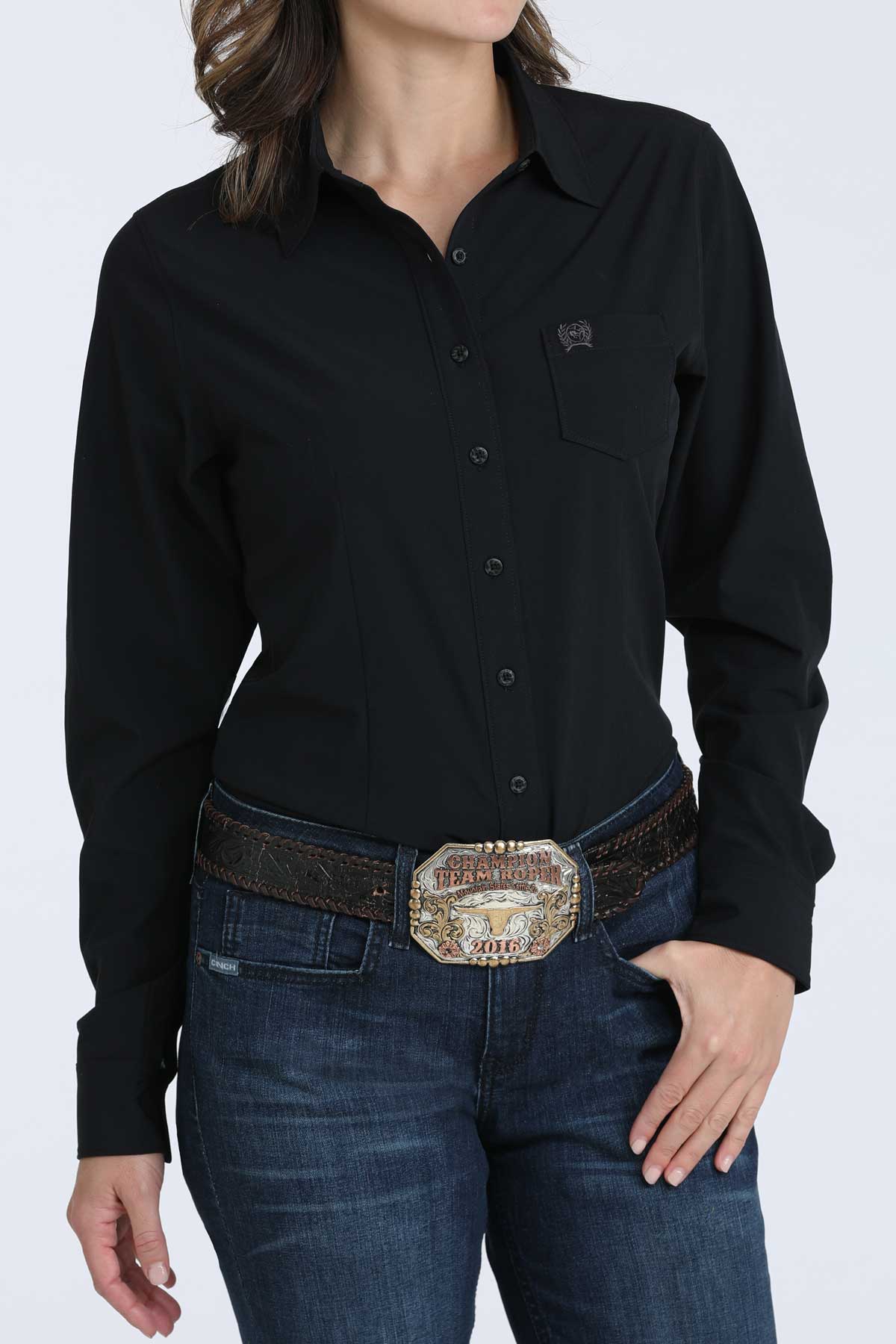 Person wearing a black shirt and blue jeans with a belt on a white background