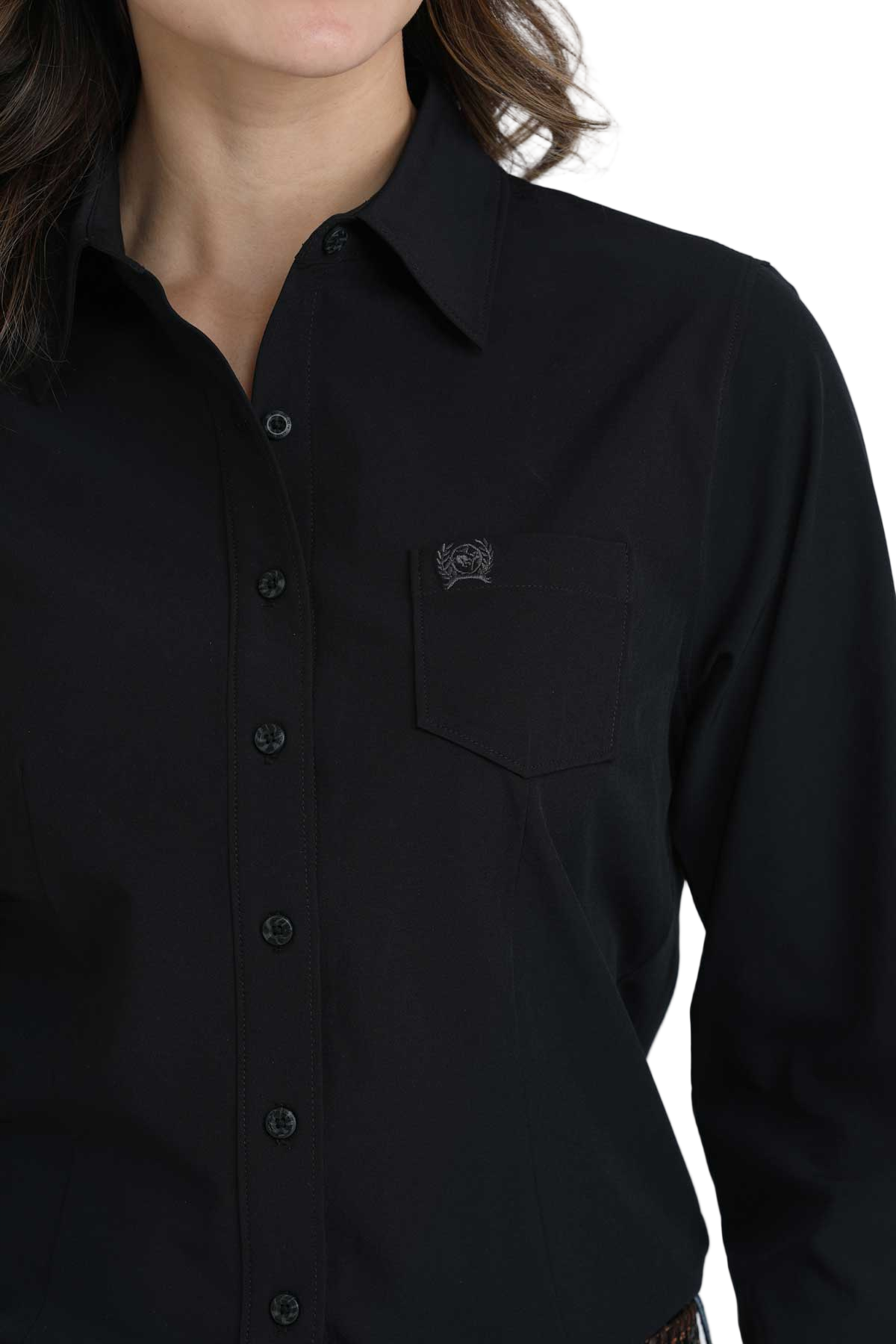 Close-up of a woman wearing a black long-sleeve button-down shirt