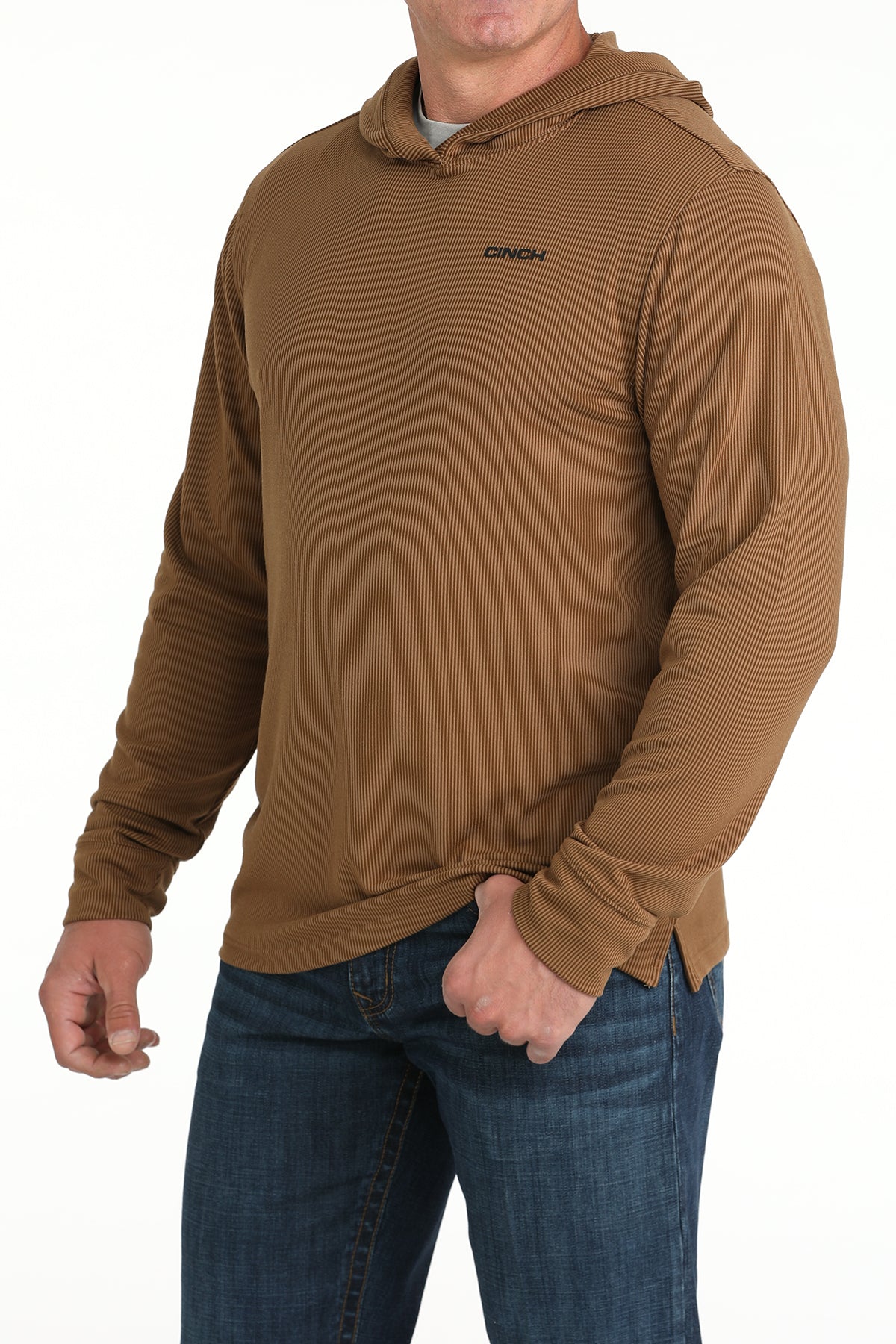 Man wearing a brown hoodie with a visible brand logo on a white background