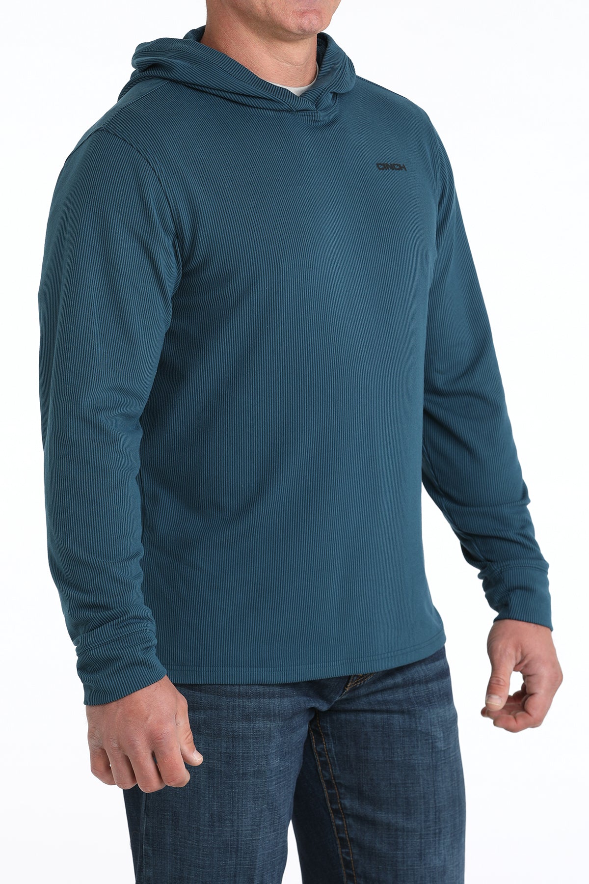 Man wearing a blue hoodie with a visible brand logo on a white background