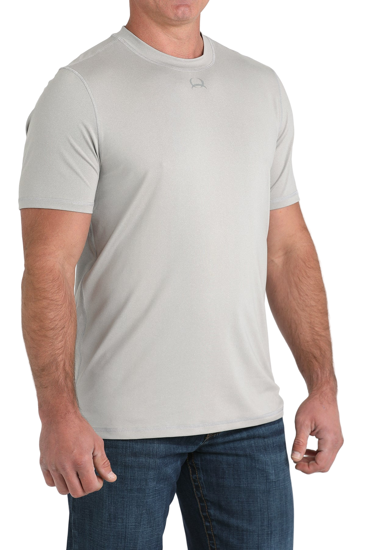 Man wearing a light grey t-shirt with jeans on a transparent background