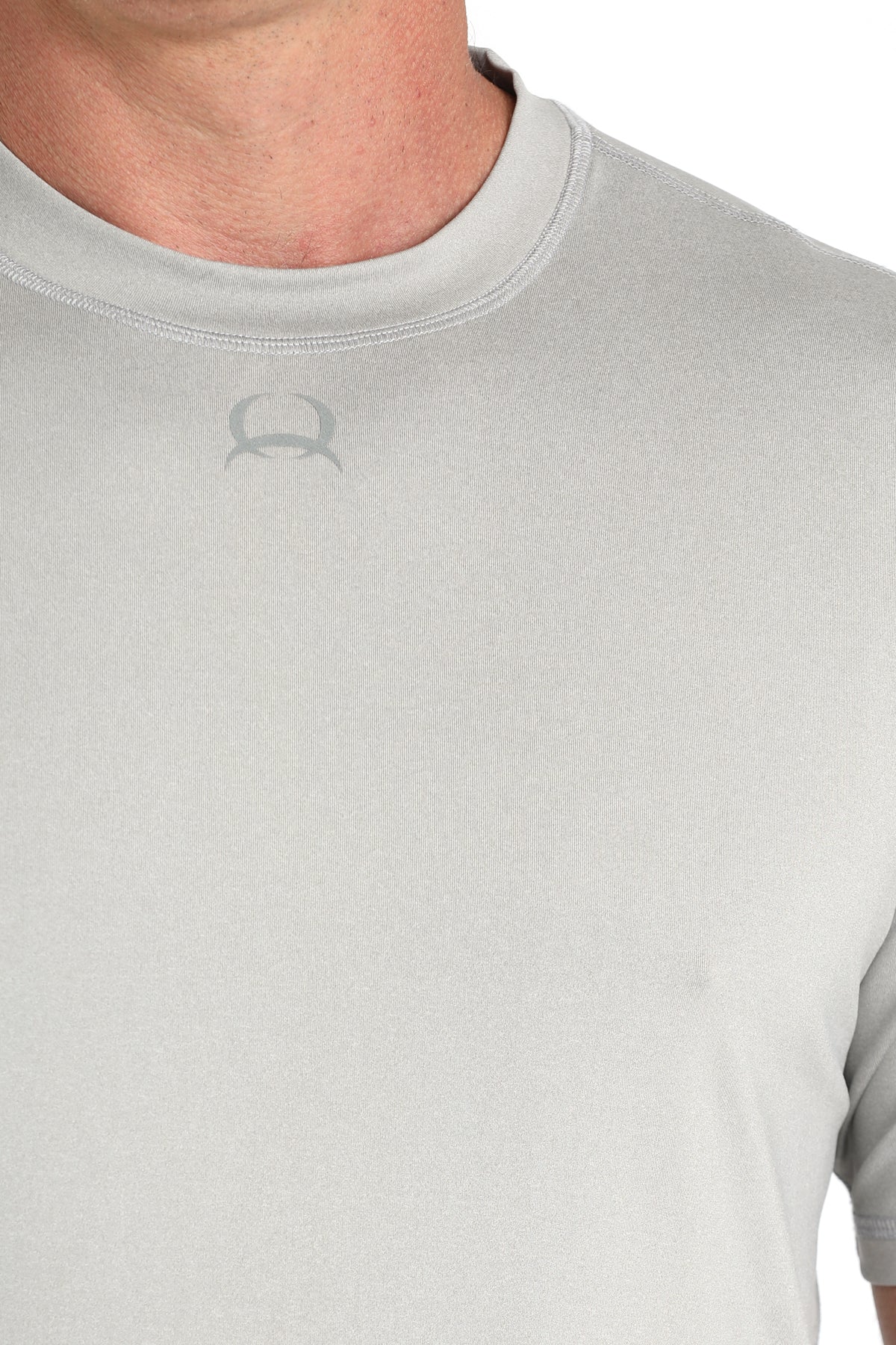Gray t-shirt with a logo on a plain background