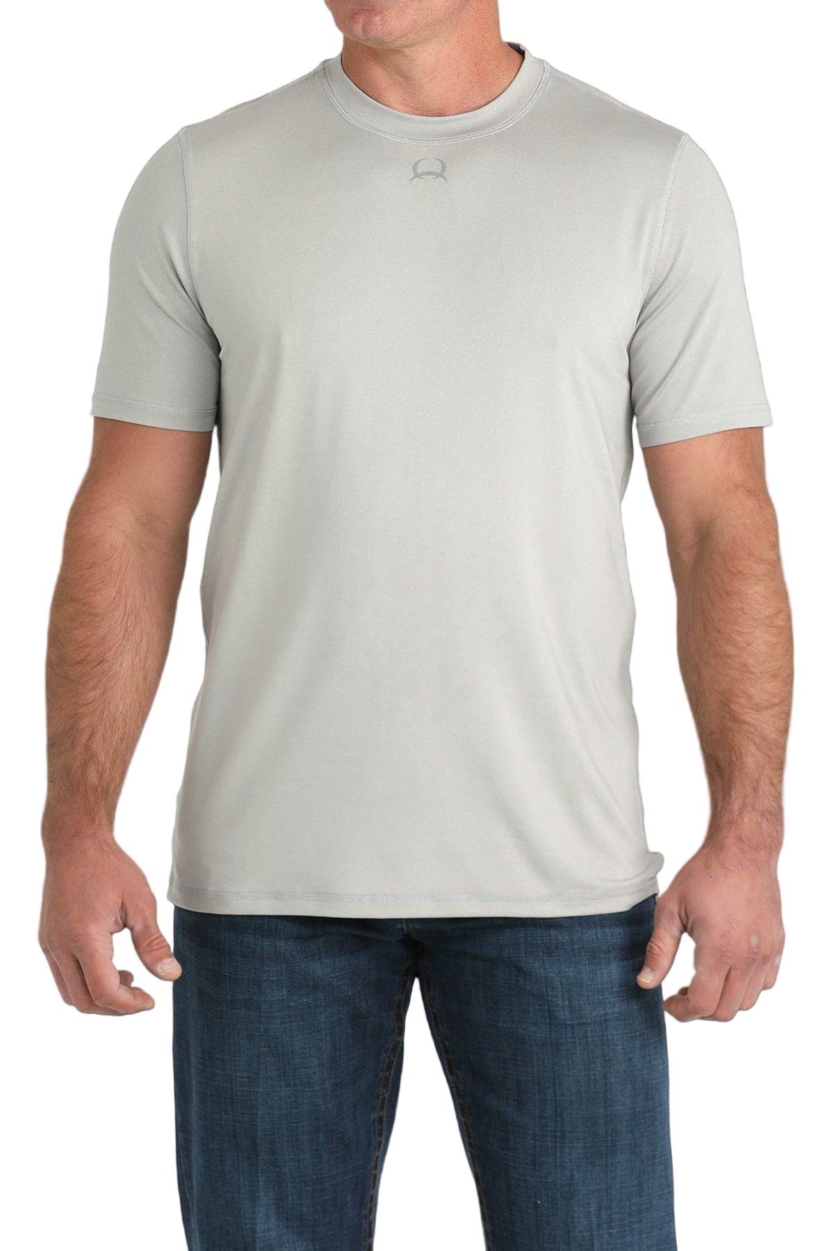 Man wearing a light grey t-shirt with jeans on a transparent background