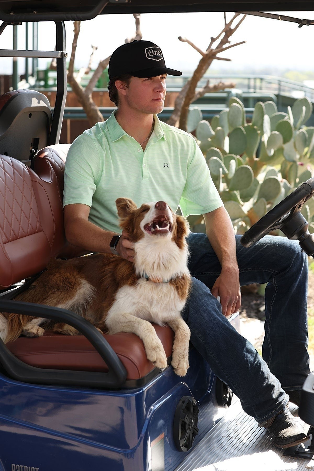 Go West Supply Men's light green short sleeve polo shirt with subtle stripes and Cinch logo. Classic collar, button placket.