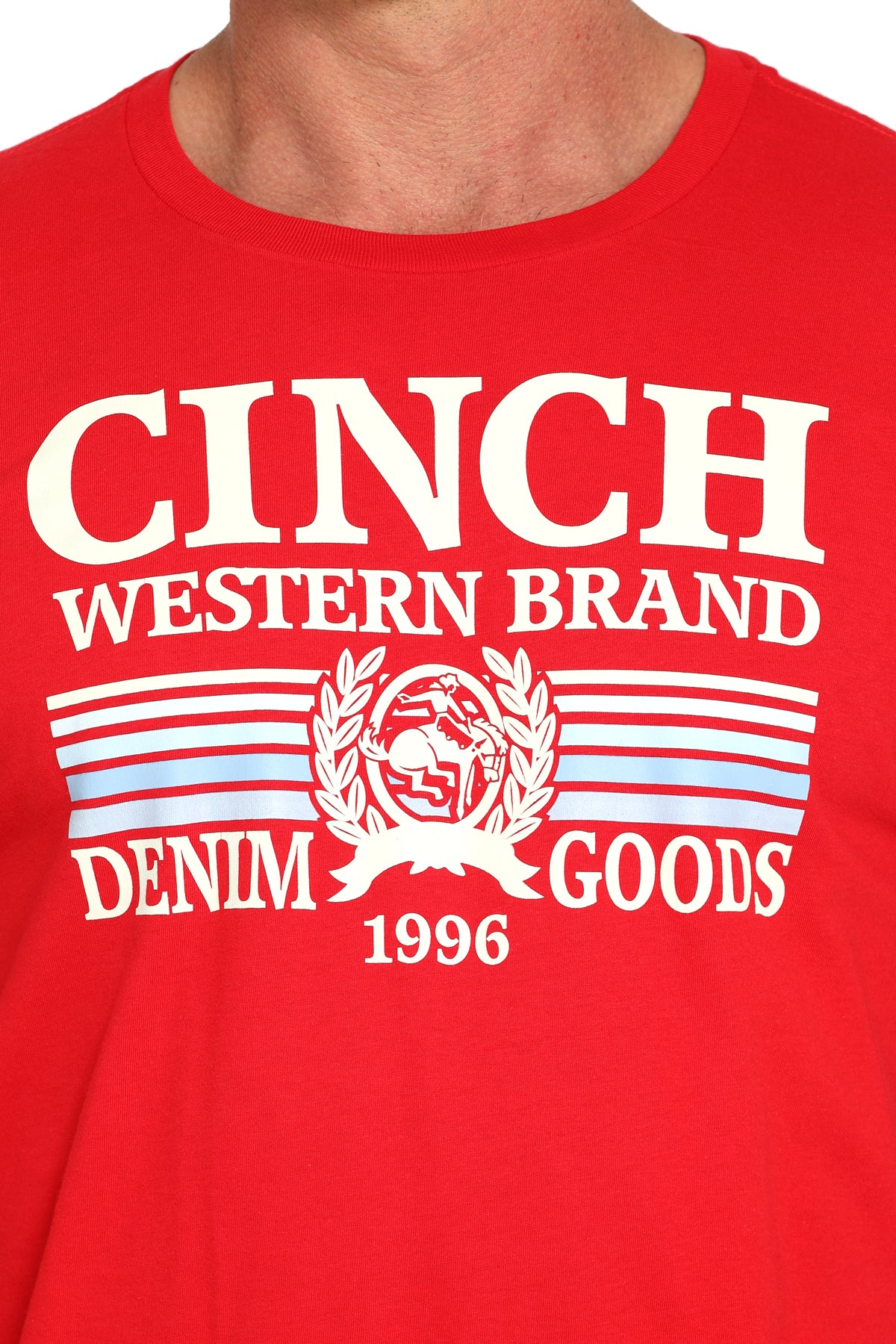 Close-up of a man wearing a red t-shirt with a large 'Cinch' graphic on the front on a white background