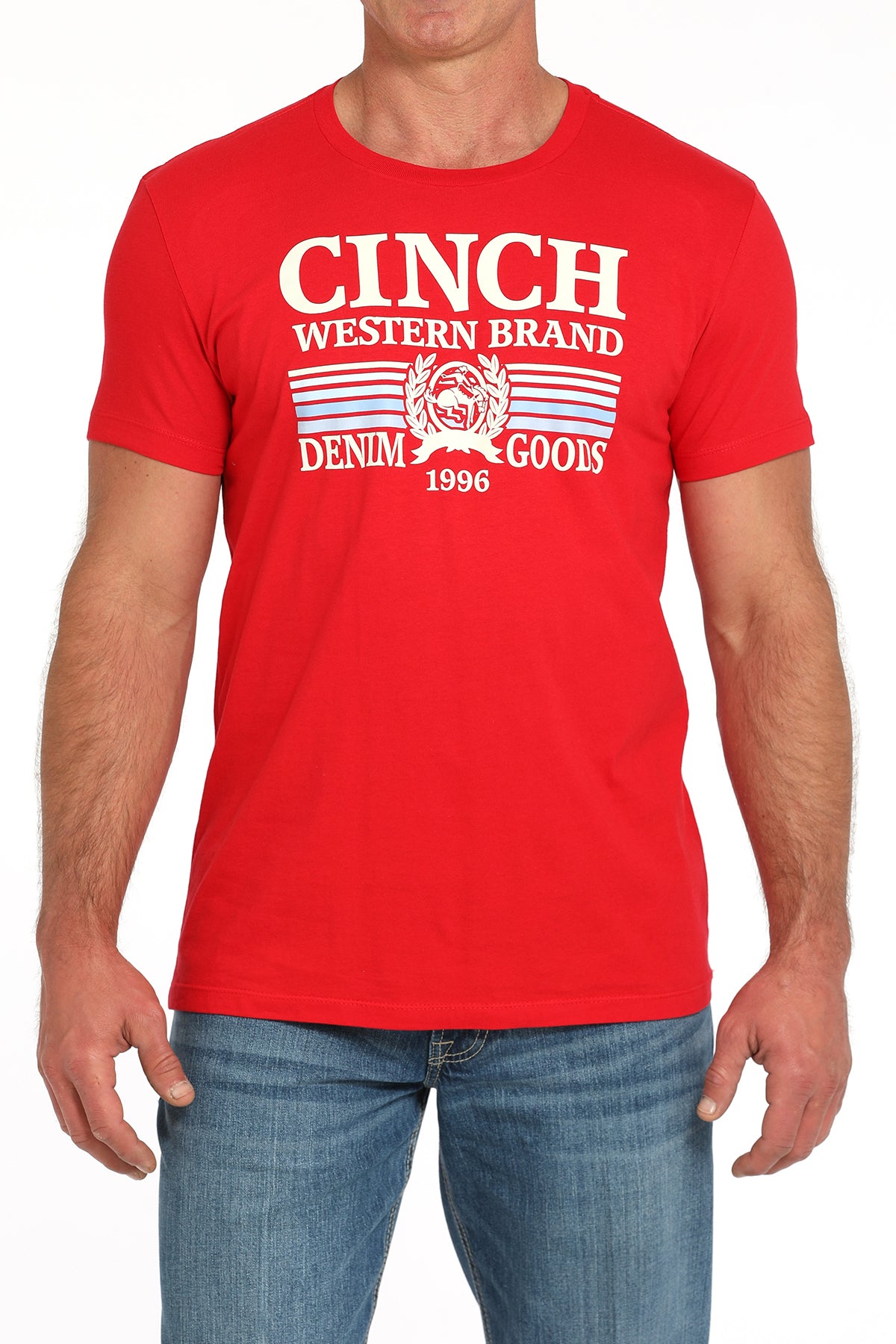 Man wearing a red t-shirt with a large 'Cinch' graphic on the front and blue jeans on a white background
