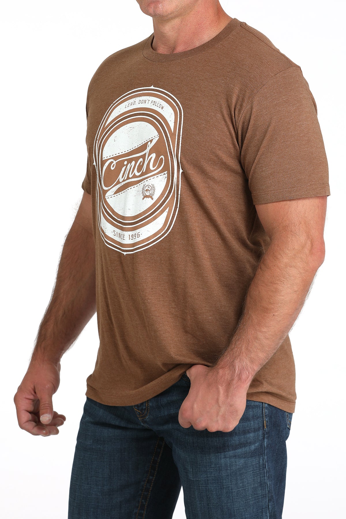 Man wearing a brown t-shirt with a logo on a white background