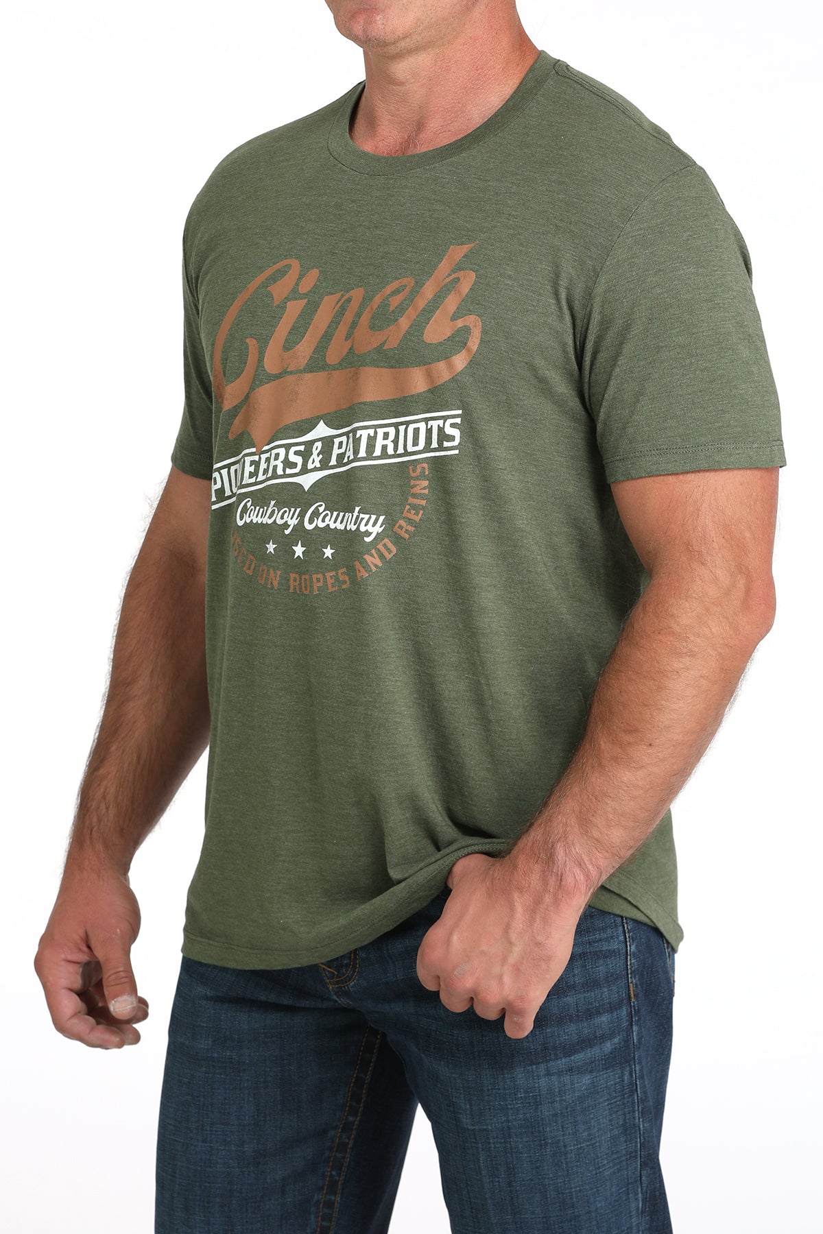 Man wearing a green t-shirt with branding on a white background