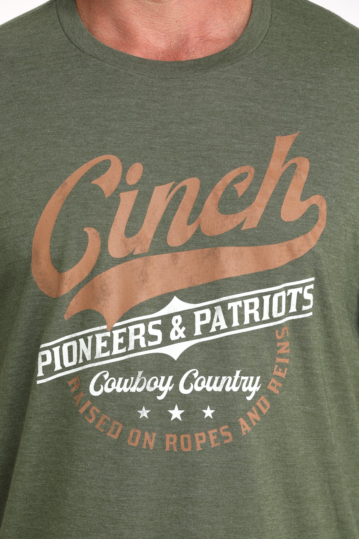 Green t-shirt with 'Cinch' branding and text on a person wearing it.
