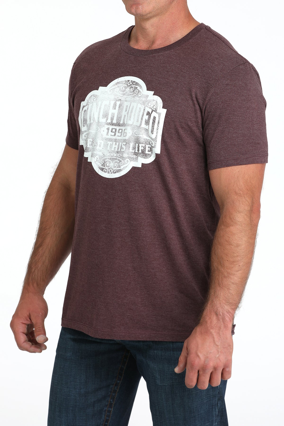 Man wearing a maroon t-shirt with a white graphic design on a white background