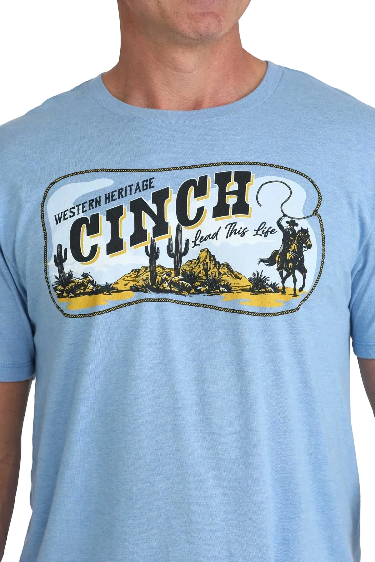 Light blue t-shirt with Cinch logo featuring a desert scene and text.