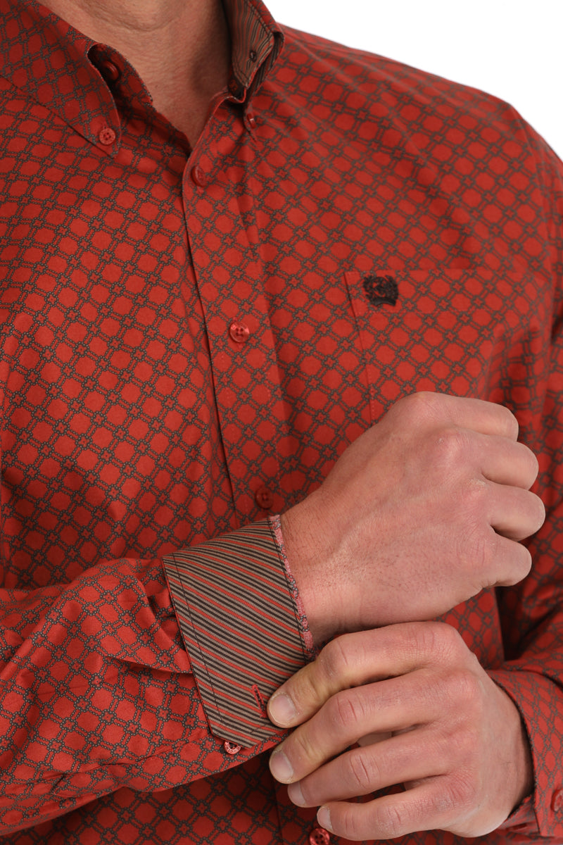 Close-up of a man wearing a red long sleeve button-down with contrasting cuffs