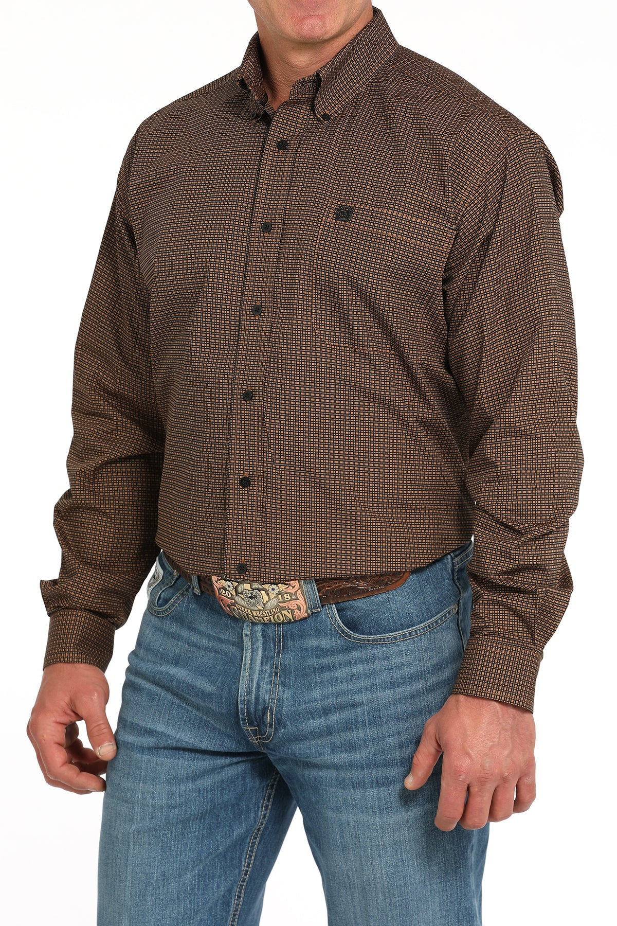 Man wearing a brown long sleeve button-down shirt with jeans and a belt