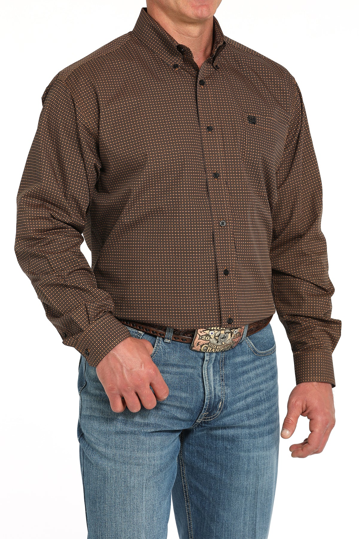Man wearing a brown long sleeve button-down shirt with jeans and a belt