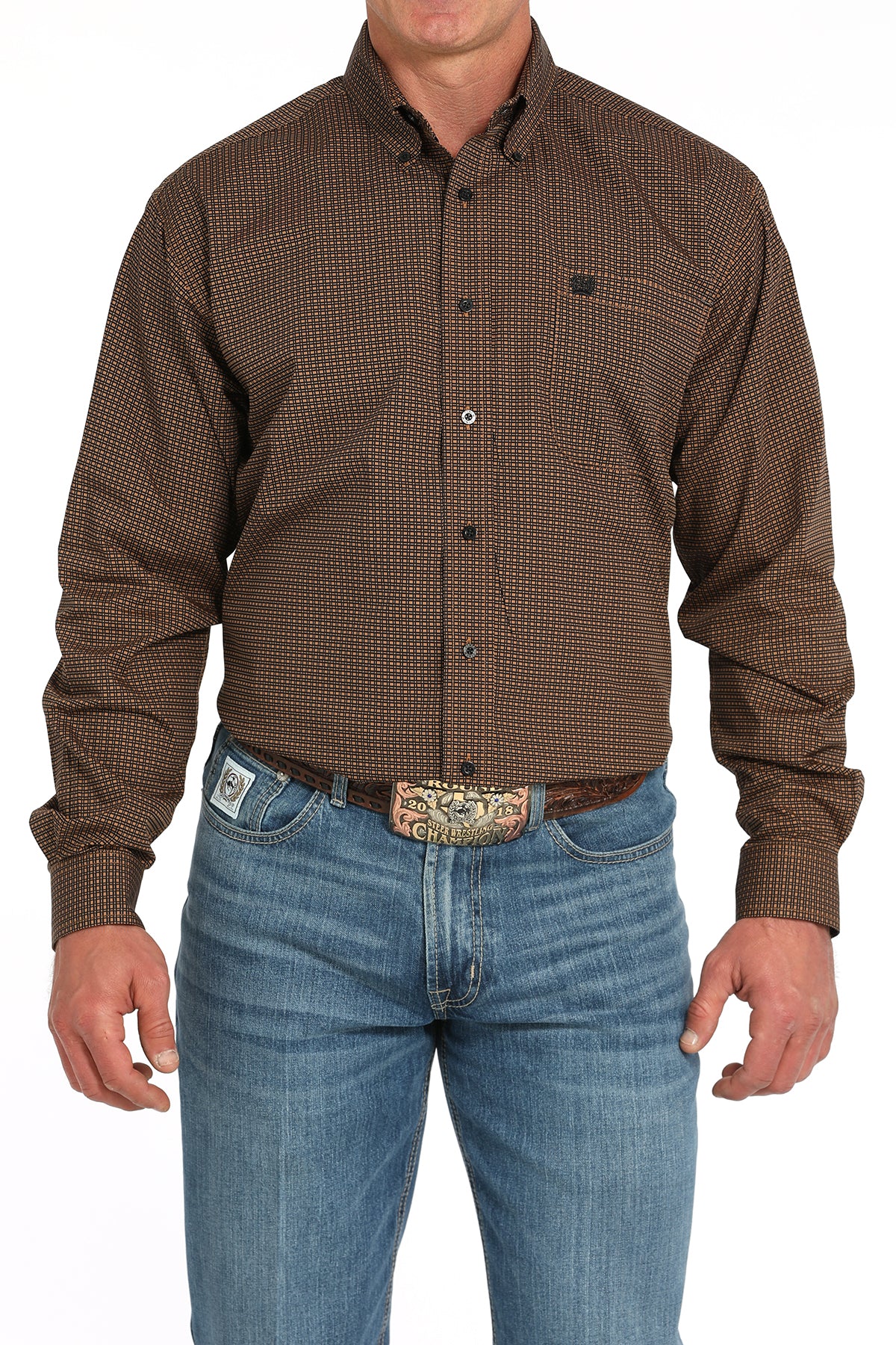 Man wearing a brown long sleeve button-down shirt with jeans and a belt