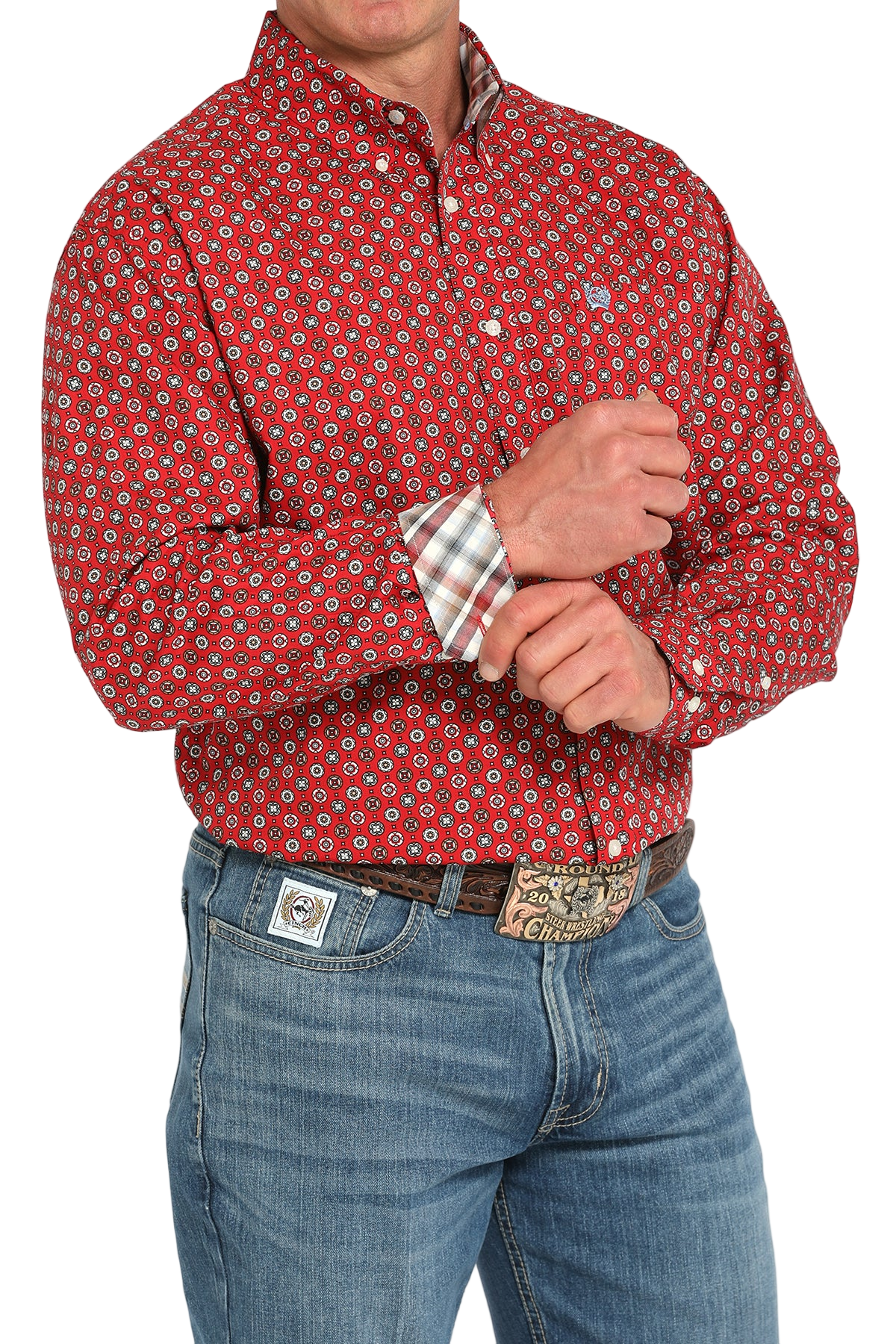Man wearing a patterned red long sleeve button-down shirt with contrasting cuffs and jeans on a transparent background