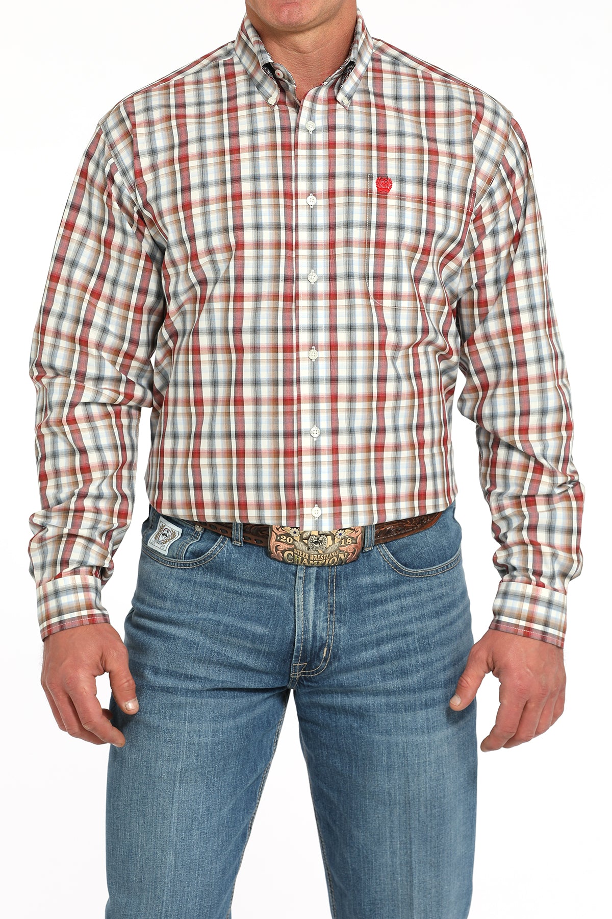 Man wearing a plaid long sleeve button-down shirt with jeans and a belt