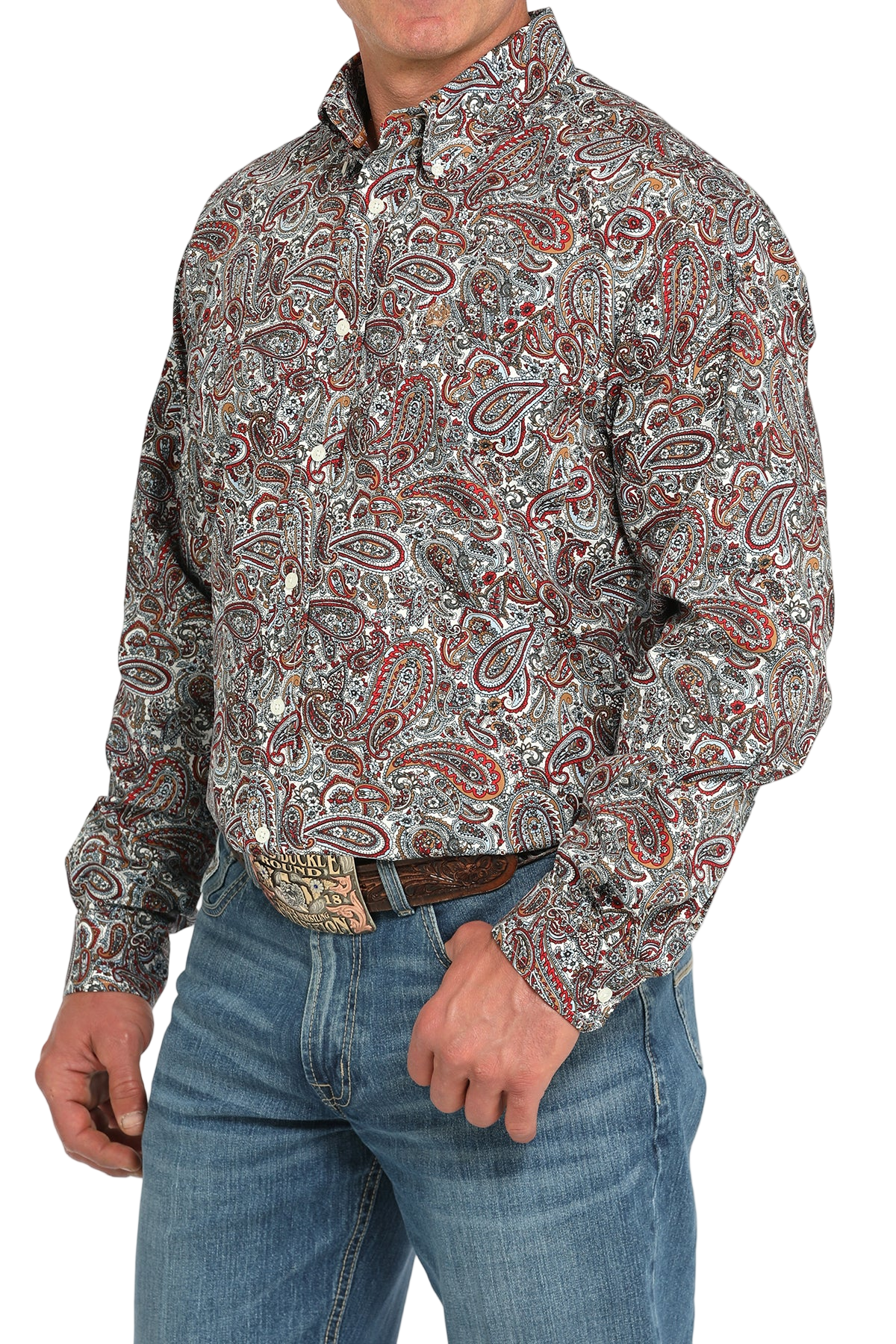 Man wearing a patterned multi-color long sleeve button-down shirt and jeans on a transparent background