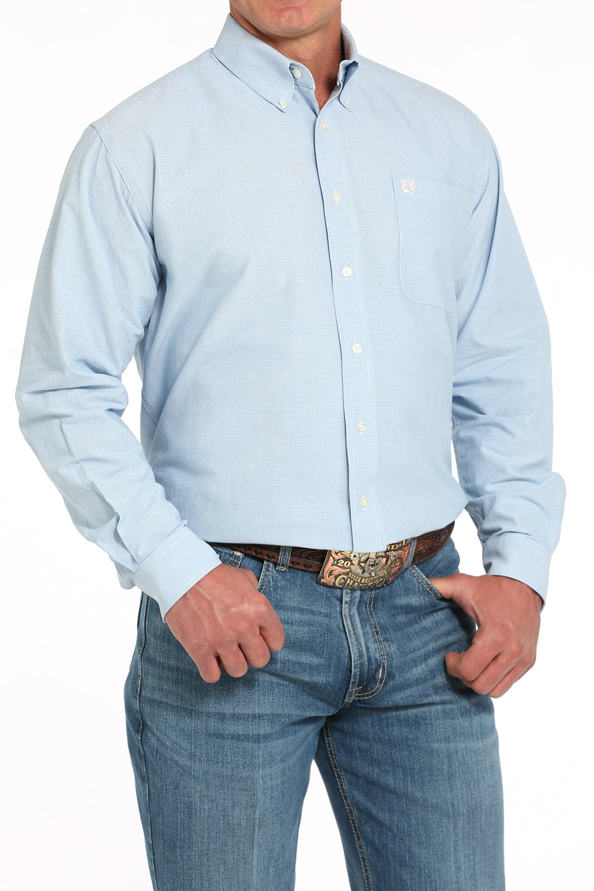 Light blue button-up shirt worn by a person on a white background
