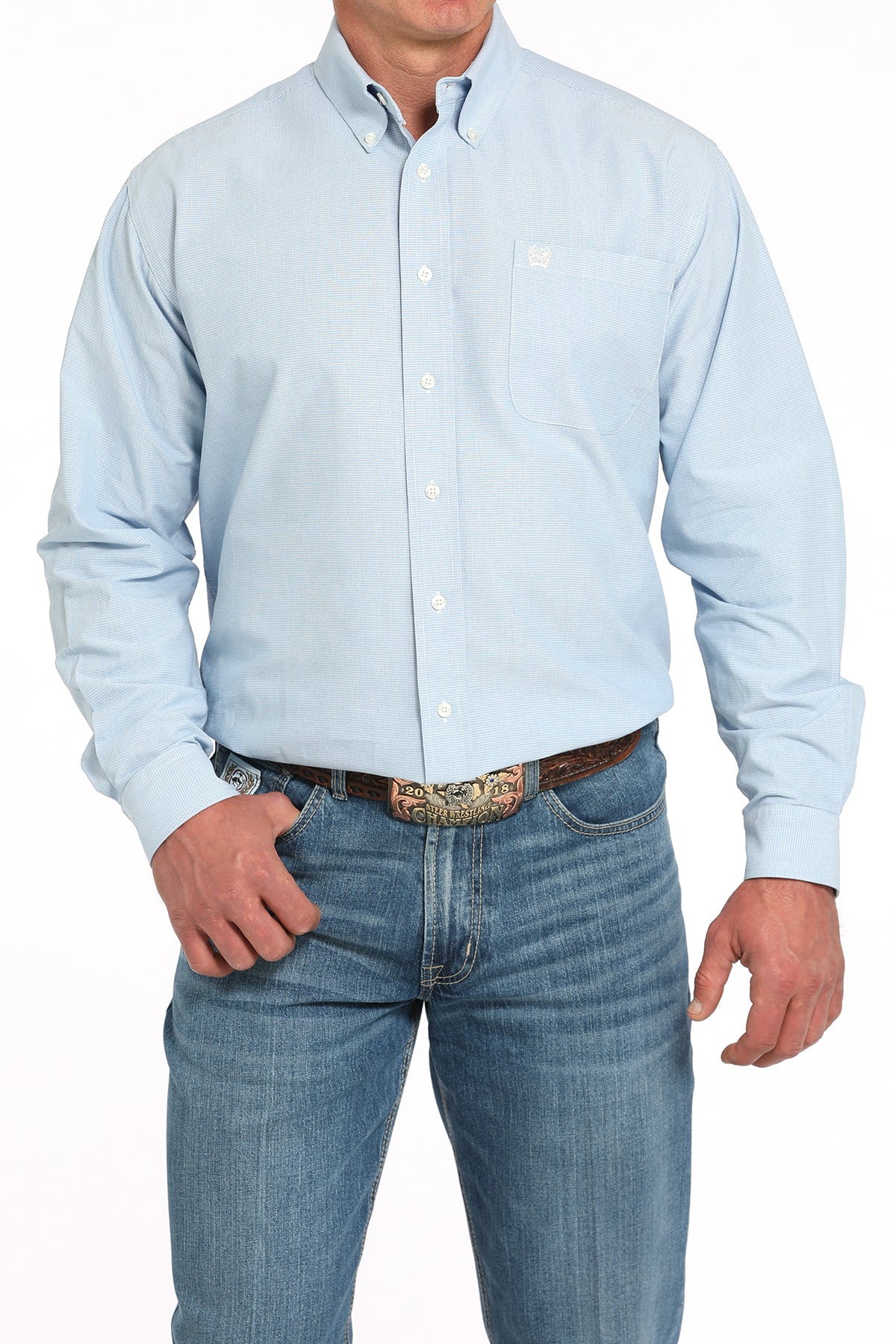 Light blue button-up shirt worn by a person on a white background