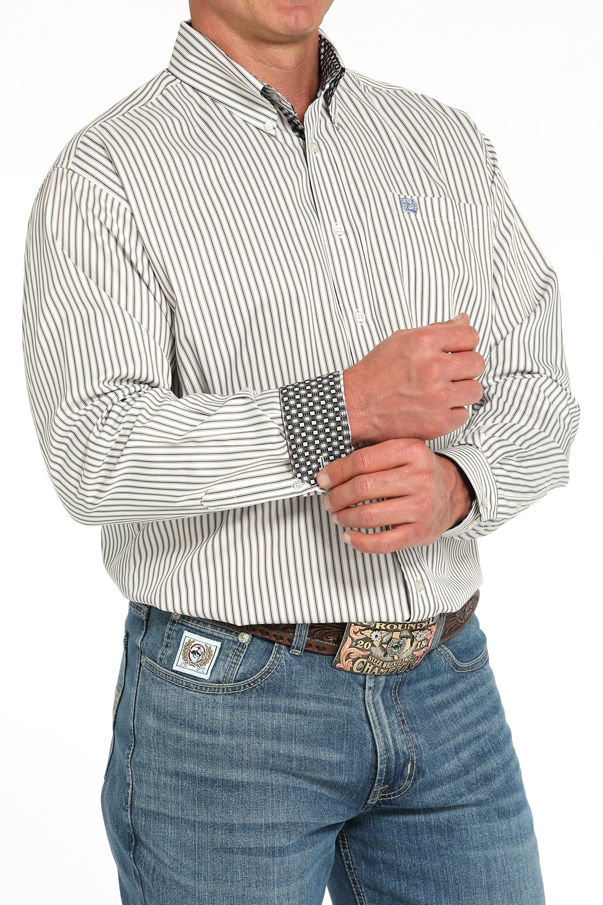 Man wearing a striped shirt and jeans on a white background