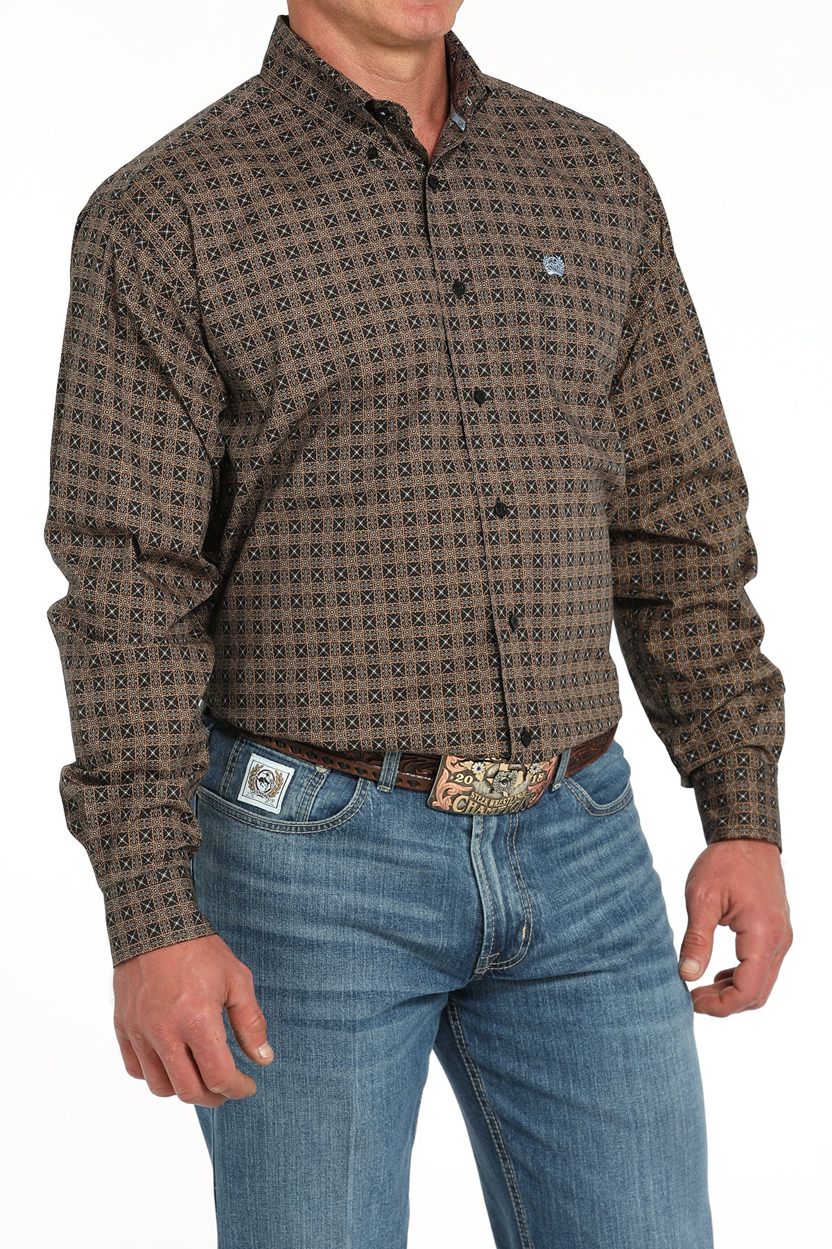 Man wearing a brown long sleeve button-down shirt with jeans and a belt