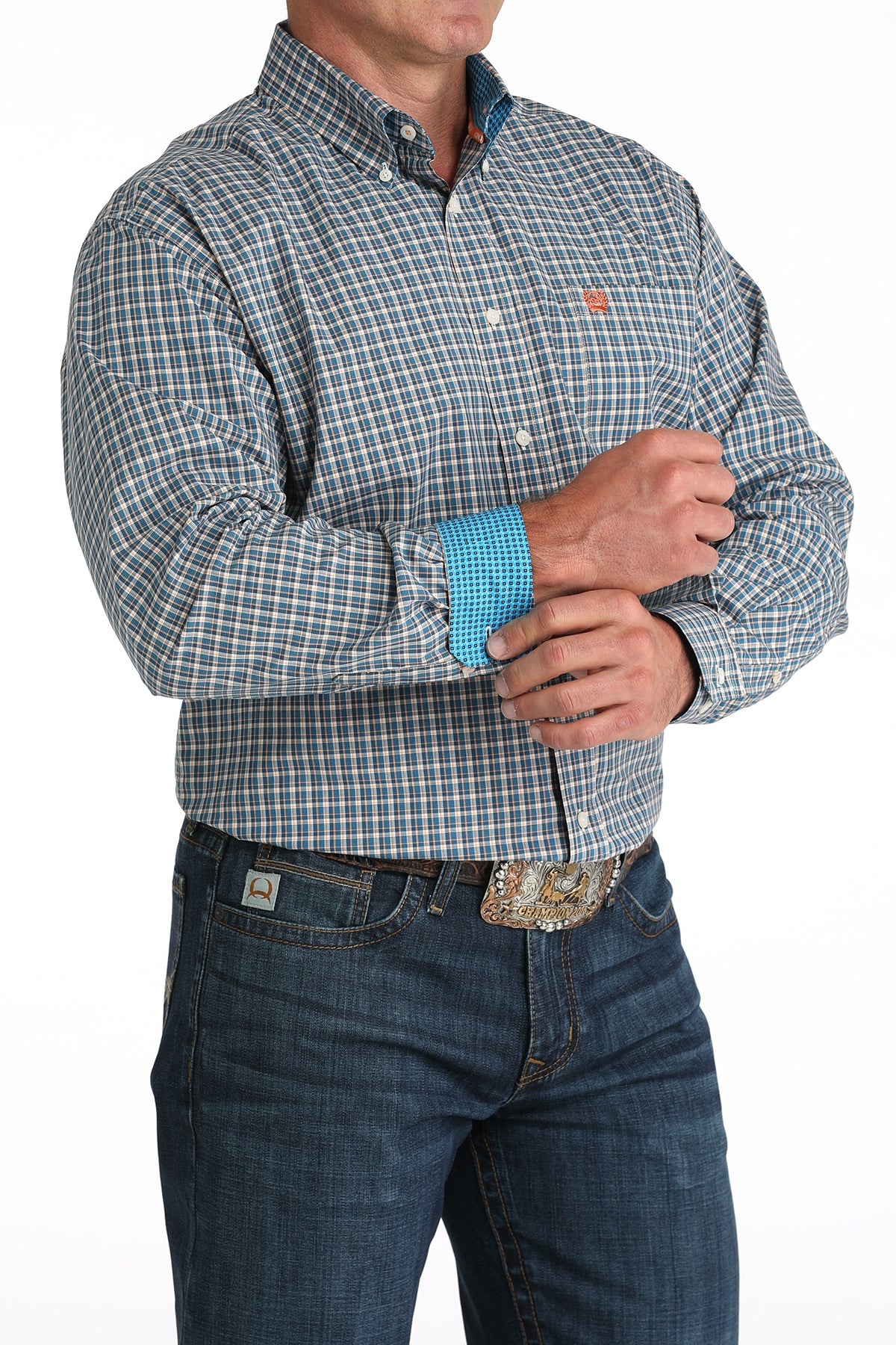 Man wearing a plaid shirt and jeans with a white background