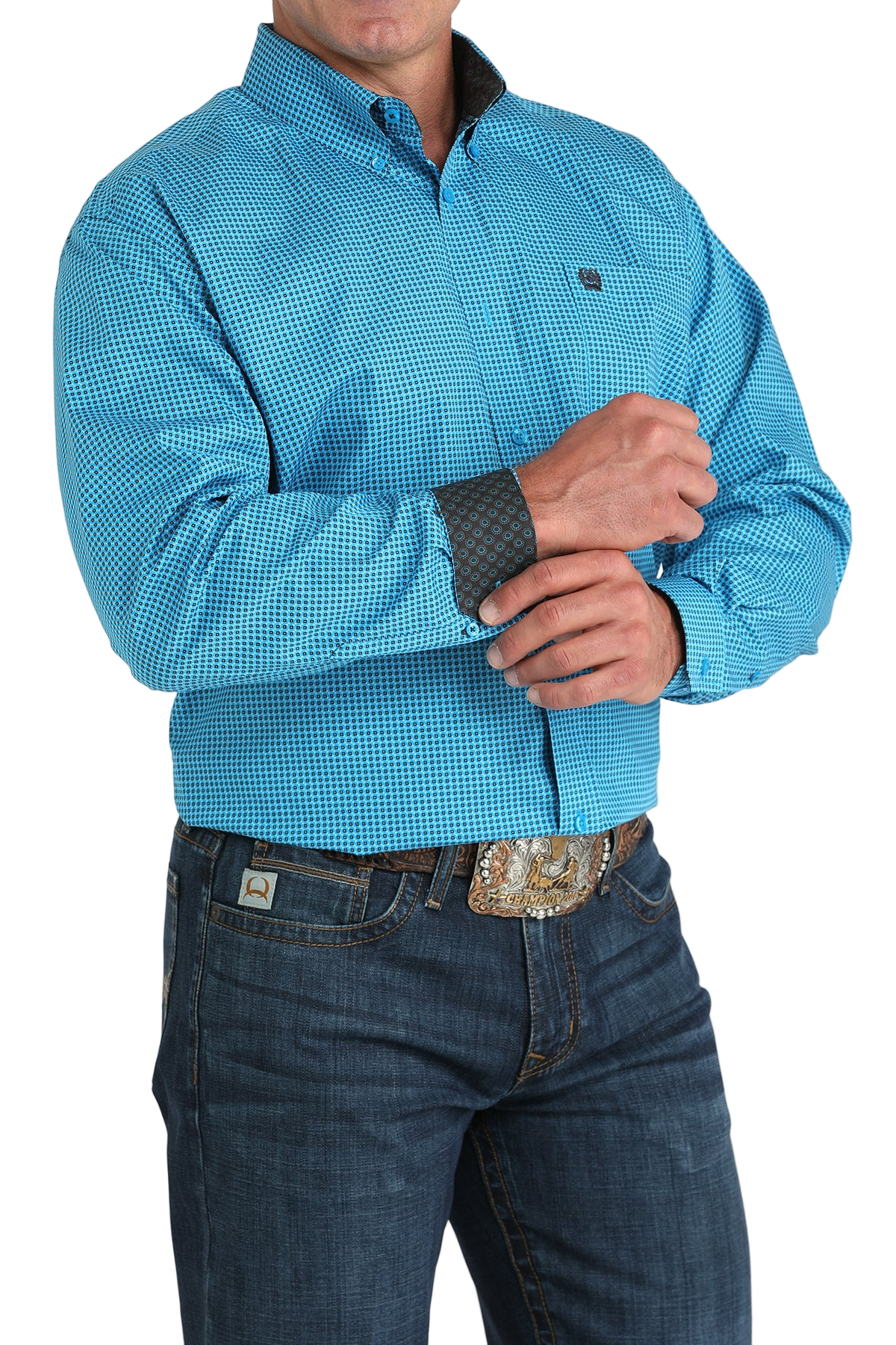 Man wearing a patterned blue long sleeve button-down shirt with contrasting cuffs and jeans on a transparent background