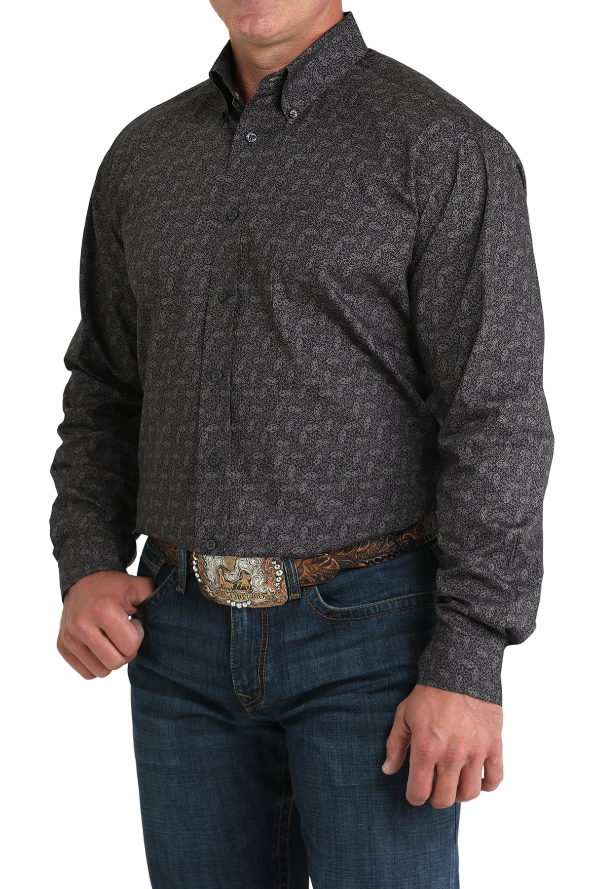 Man wearing a patterned black long sleeve button-down shirt and jeans on a transparent background