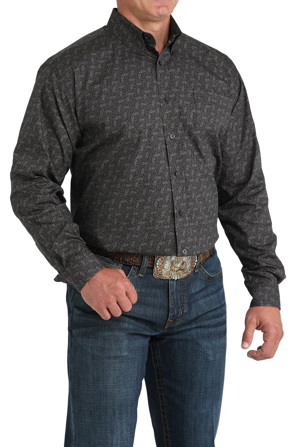 Man wearing a patterned black long sleeve button-down shirt and jeans on a transparent background
