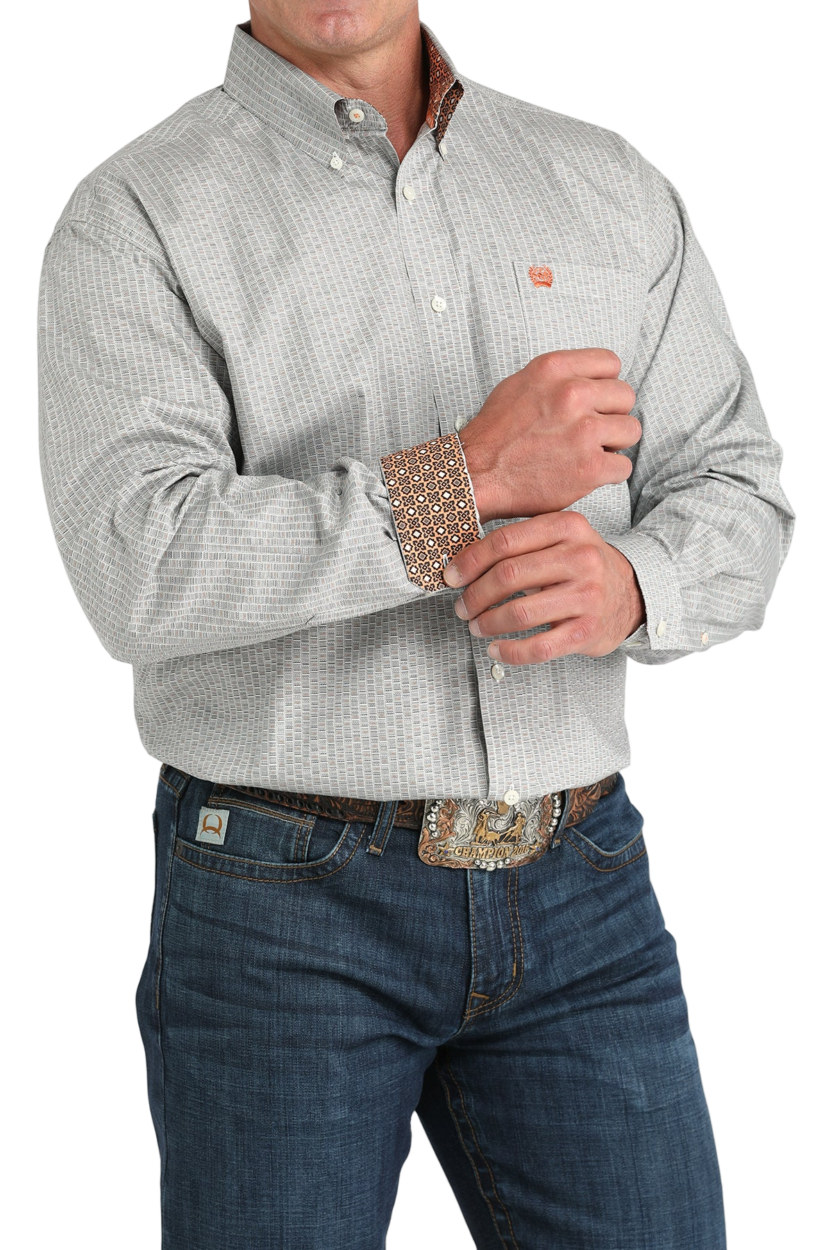 Man wearing a patterned gray long sleeve button-down shirt with contrasting cuffs and jeans on a transparent background