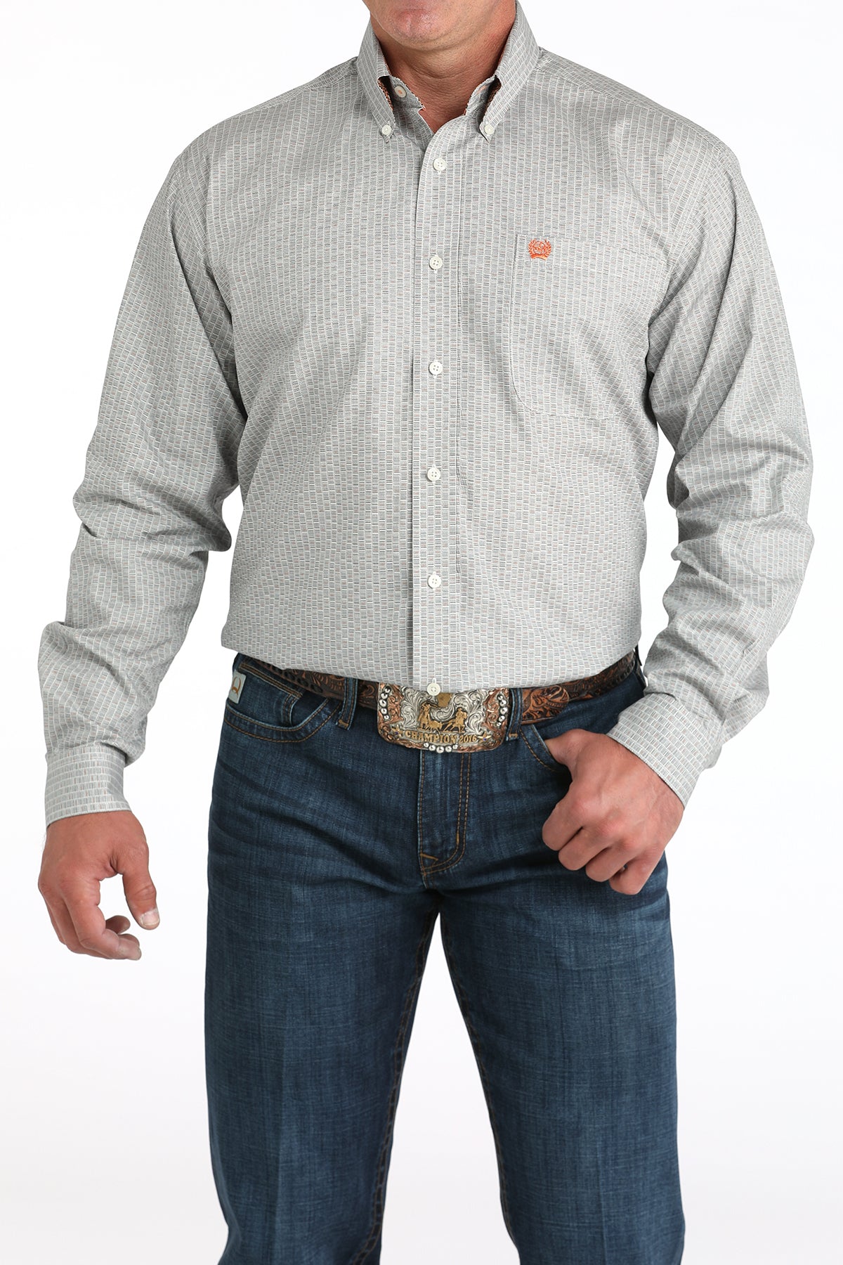 Man wearing a light gray checkered shirt and blue jeans on a white background