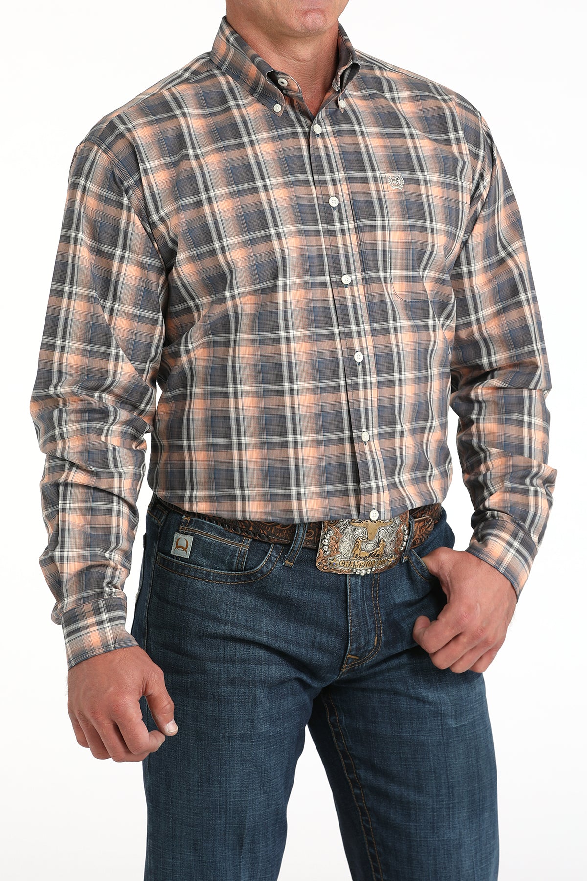 Man wearing a plaid shirt and jeans on a white background