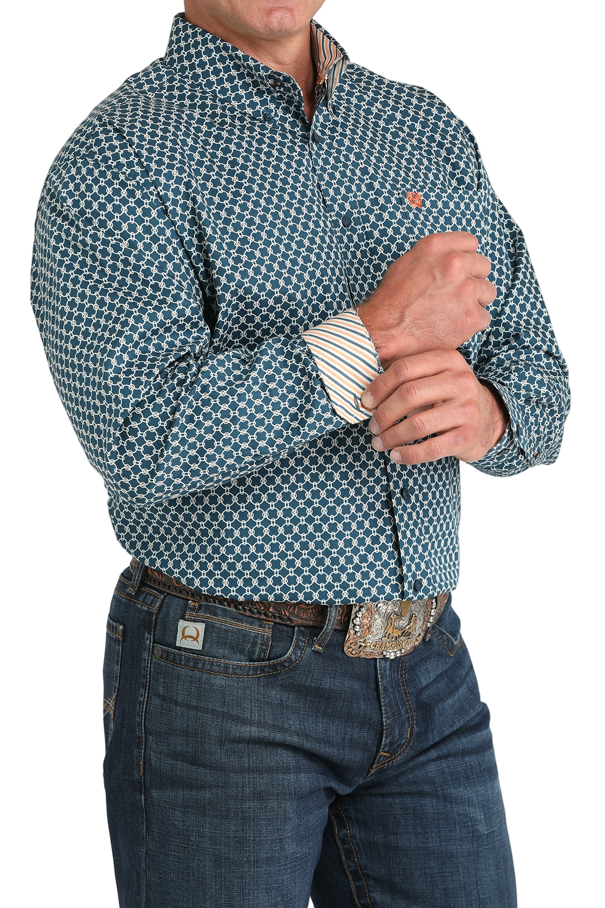 Man wearing a patterned teal long sleeve button-down shirt with contrasting cuffs and jeans on a transparent background