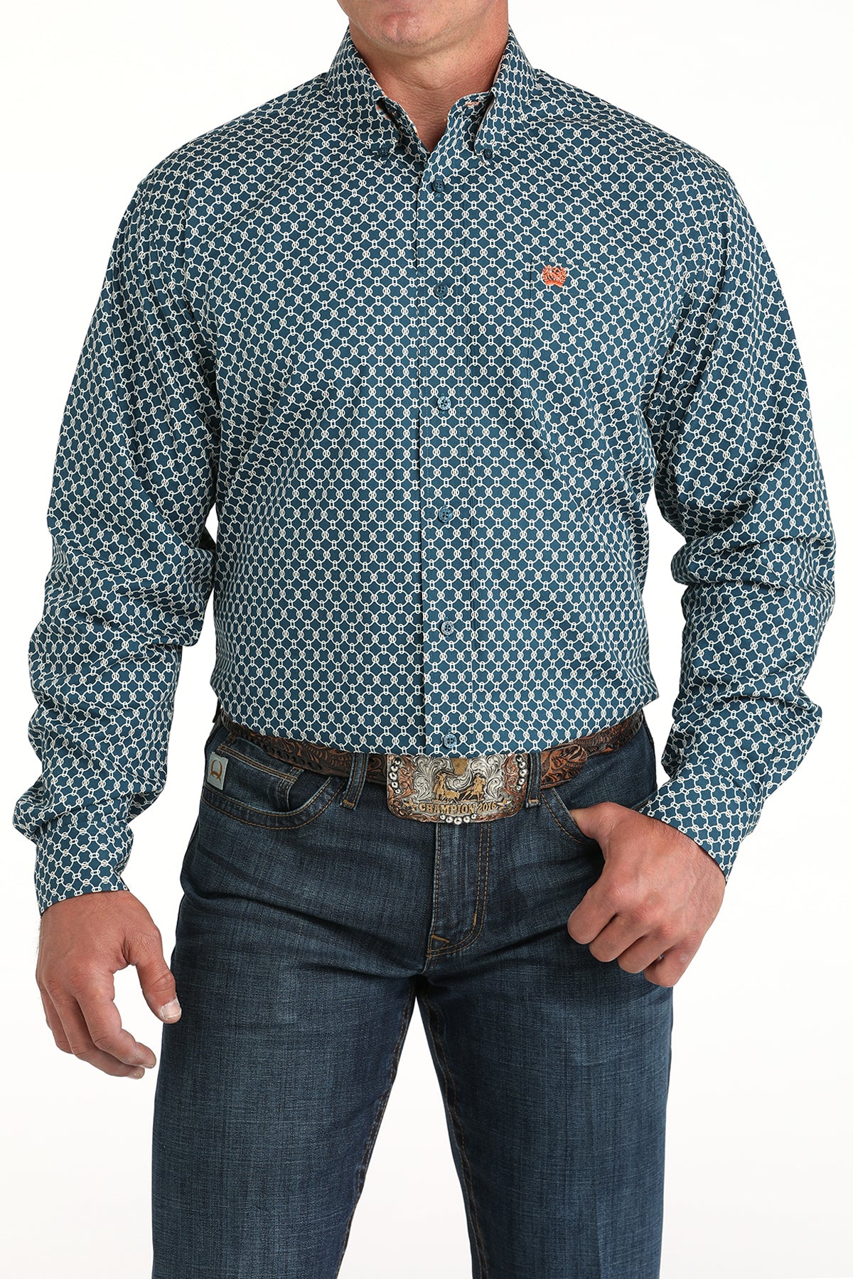 Man wearing a teal long sleeve button-down shirt with jeans and a belt
