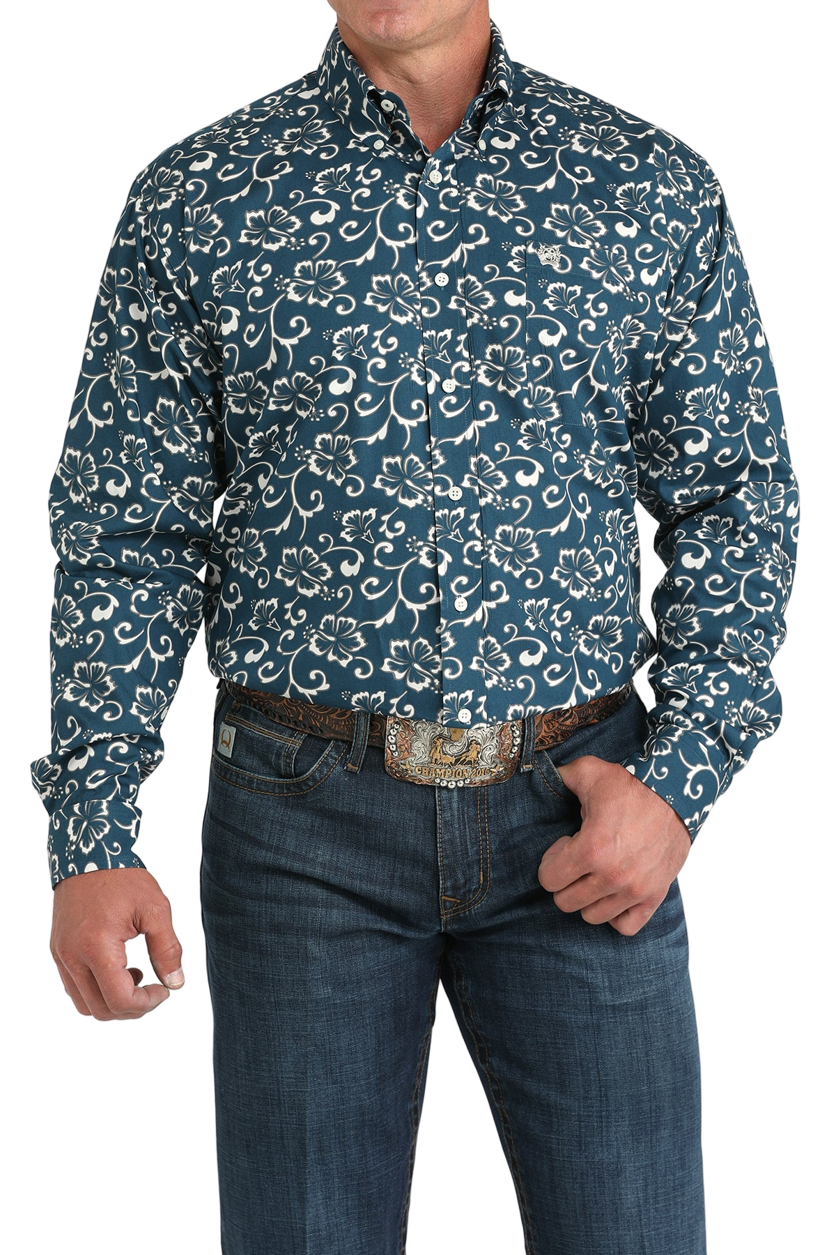 Man wearing a blue patterned button-up shirt with blue jeans on a white background