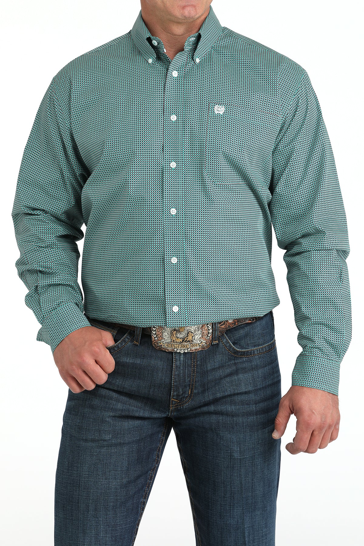 Man wearing a teal long sleeve button-down shirt with jeans and a belt