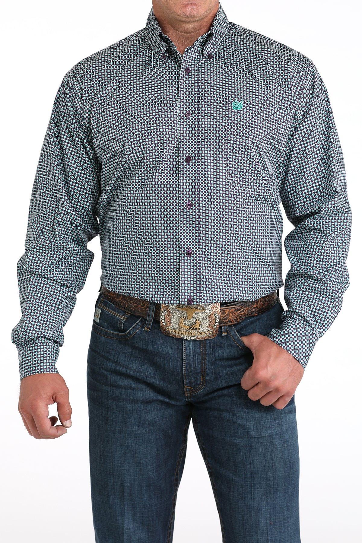Man wearing a purple long sleeve button-down shirt with jeans and a belt