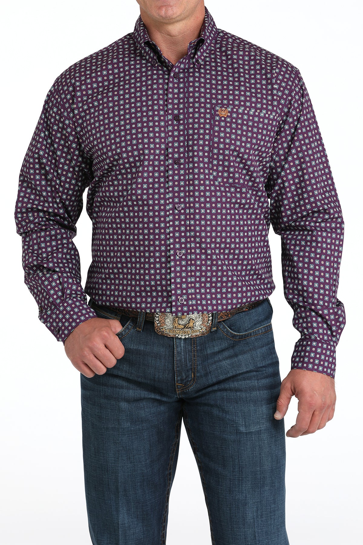 Man wearing a checkered purple long sleeve button-down shirt with jeans and a belt