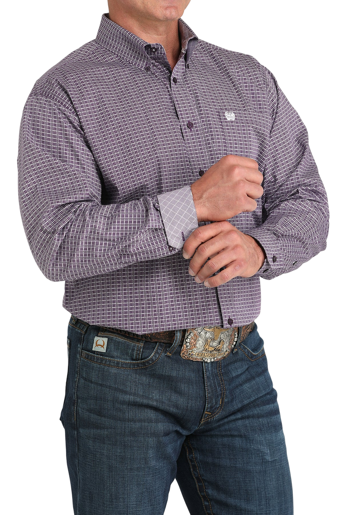 Man wearing a patterned purple long sleeve button-down shirt with contrasting cuffs and jeans on a transparent background