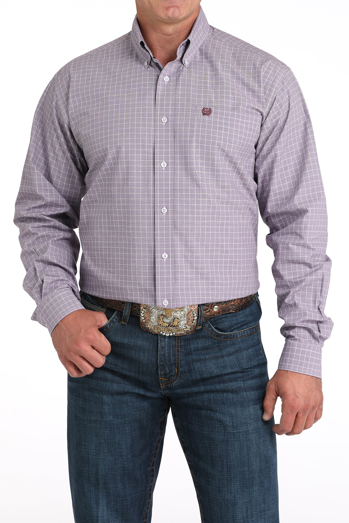 Man wearing a plaid purple long sleeve button-down shirt with jeans and a belt